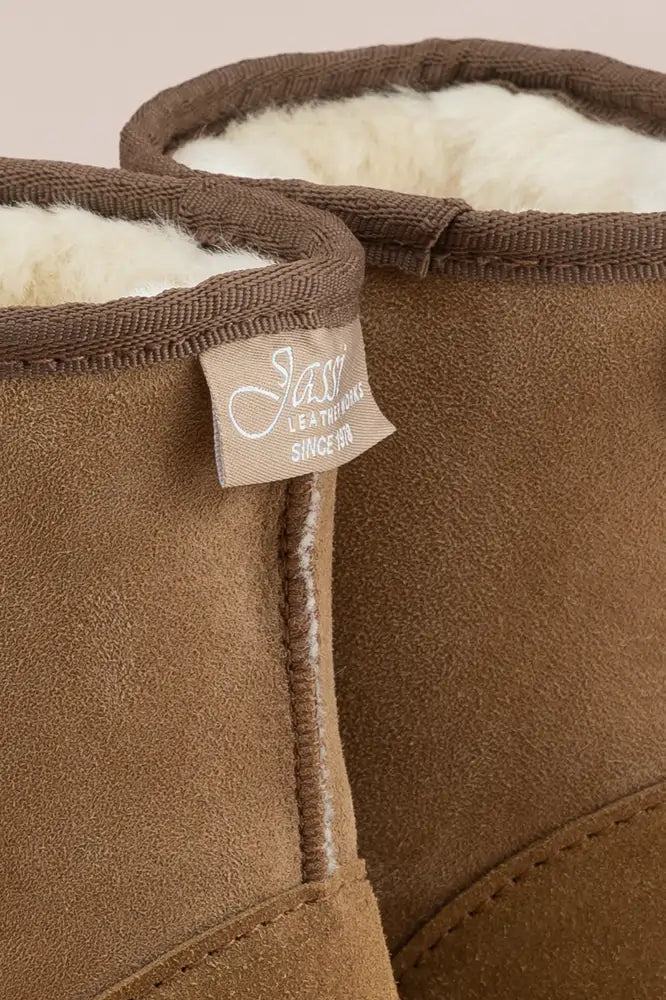 Close up of Jassi label on tan suede ugg boots.