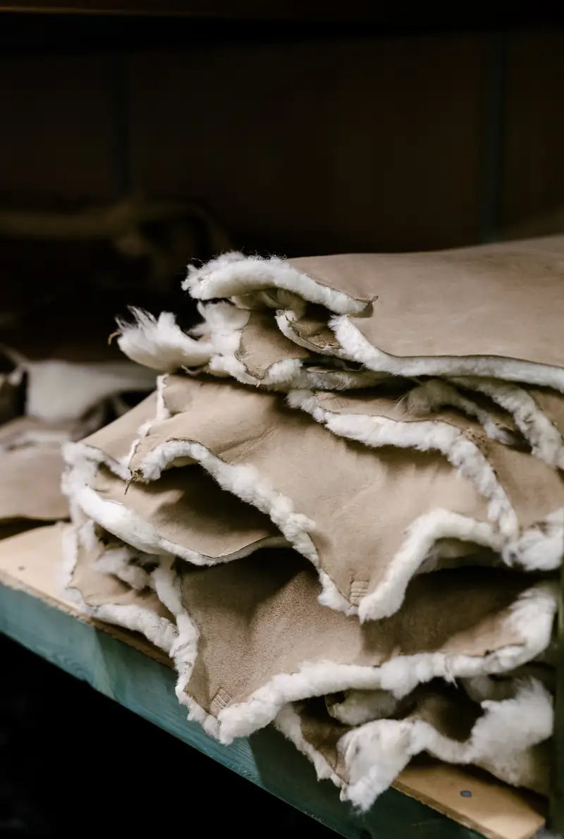 Sheepskins used to handcraft ugg boots stacked in the Jassi shop.