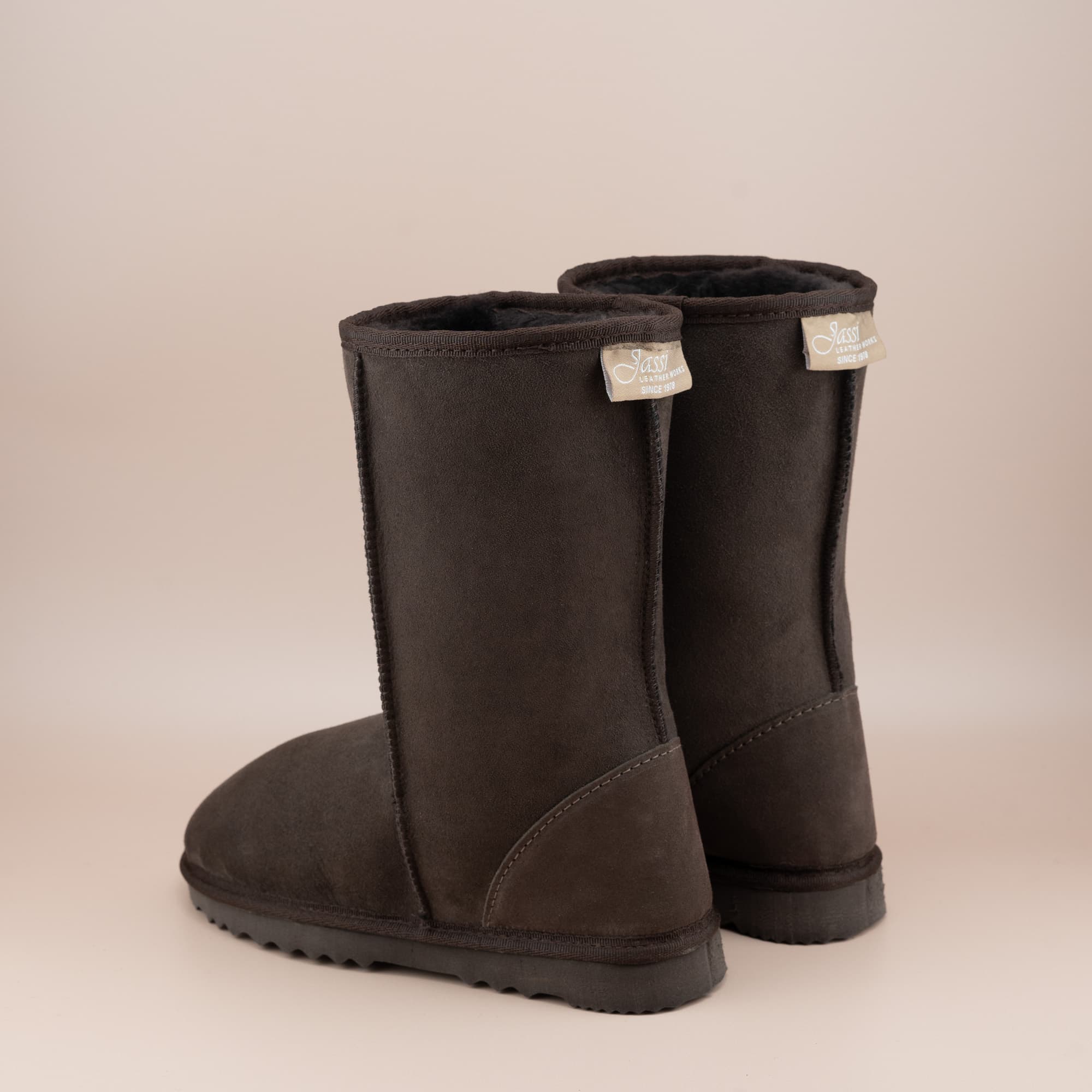 Kid's classic mid ugg boot in suede chocolate color, back view. #color_chocolate