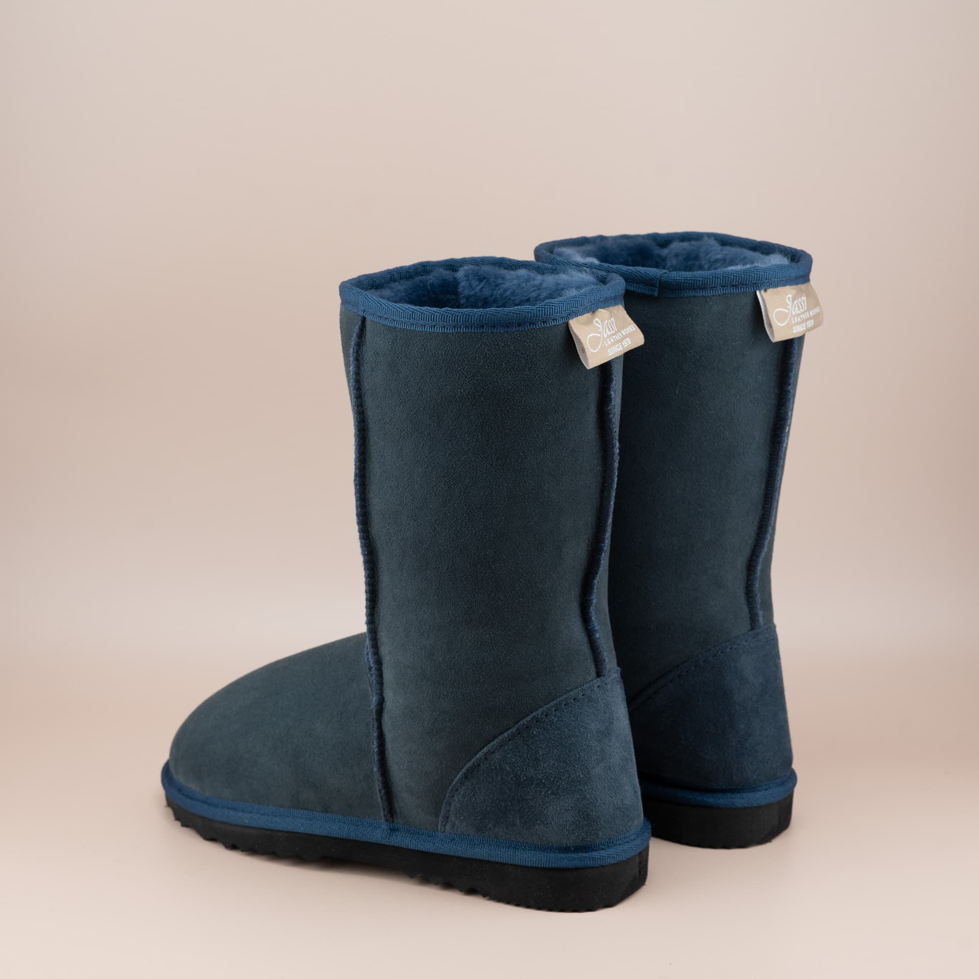 Kid's classic mid ugg boot in suede navy color, back view. #color_navy