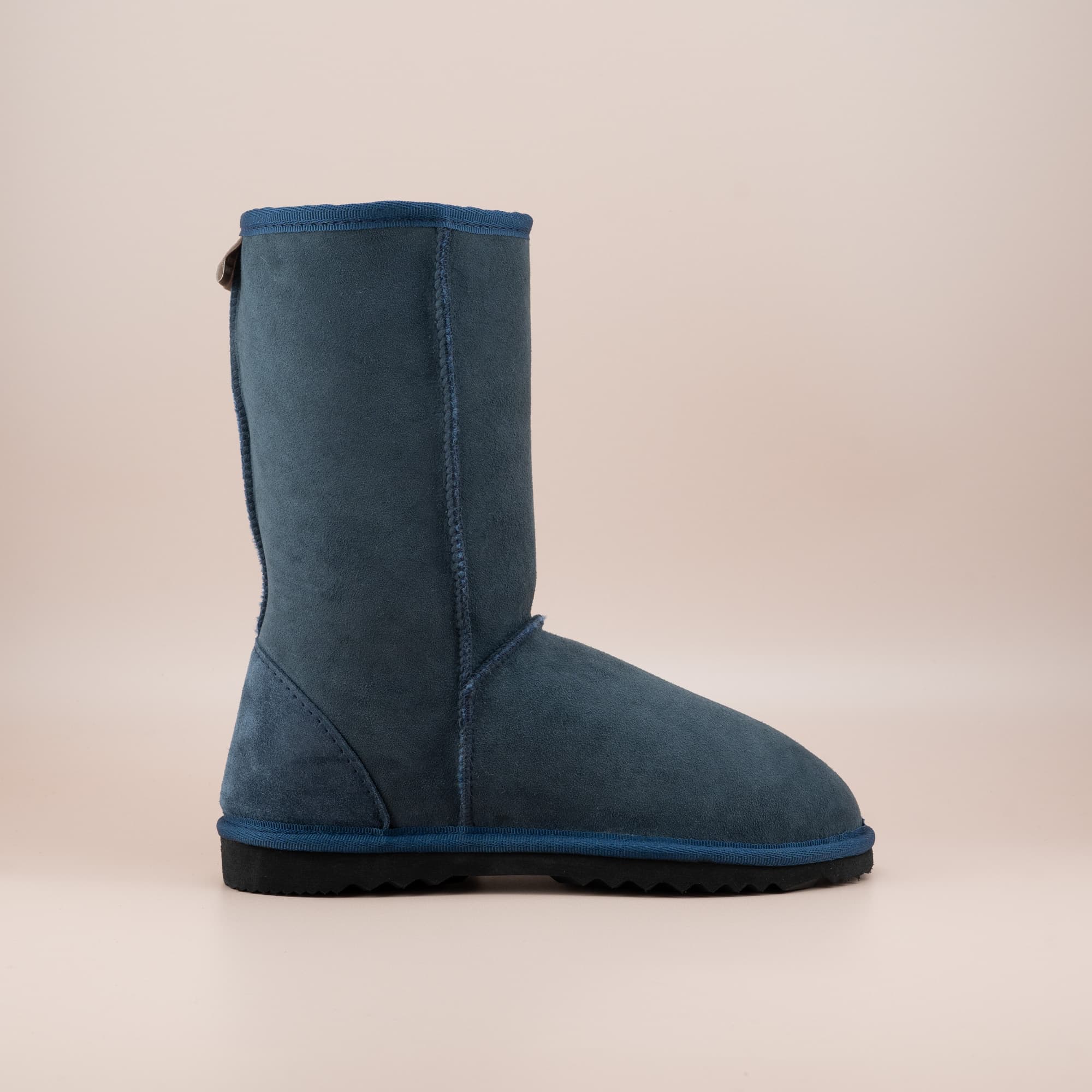 Kid's classic mid ugg boot in suede navy color, side view. #color_navy