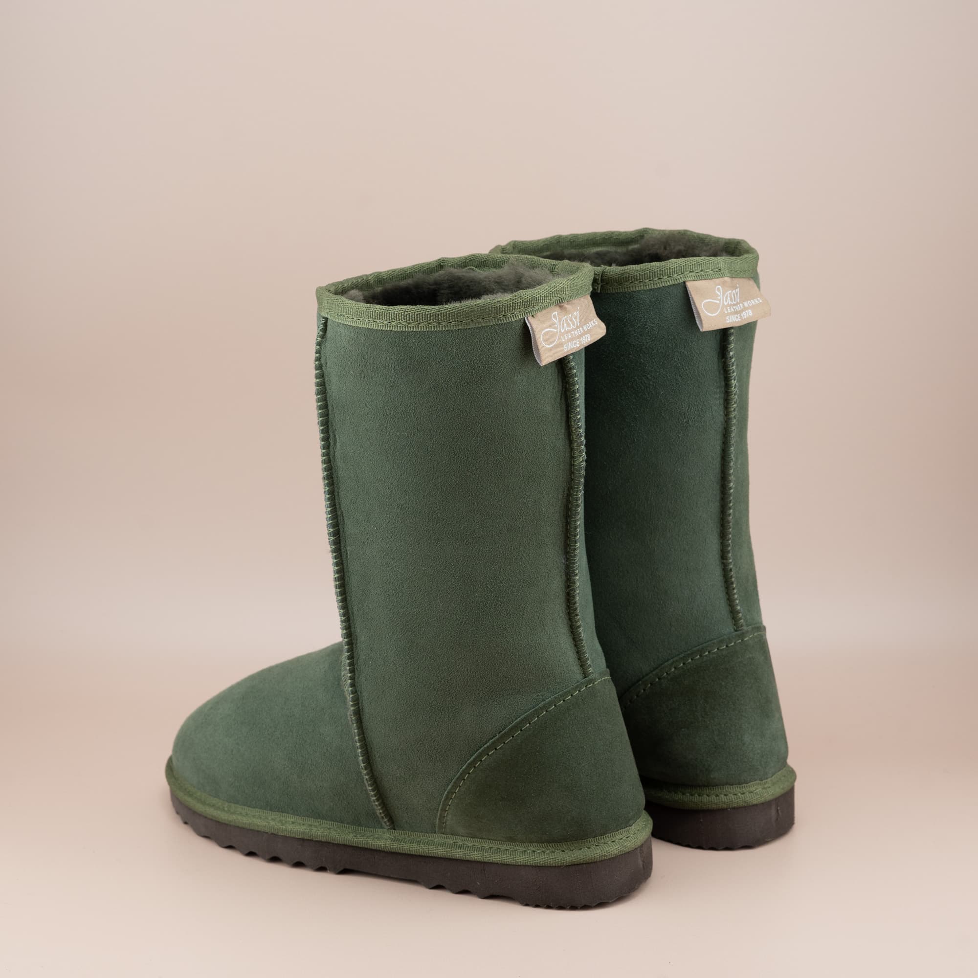 Kid's classic mid ugg boot in suede olive color, back view. #color_olive