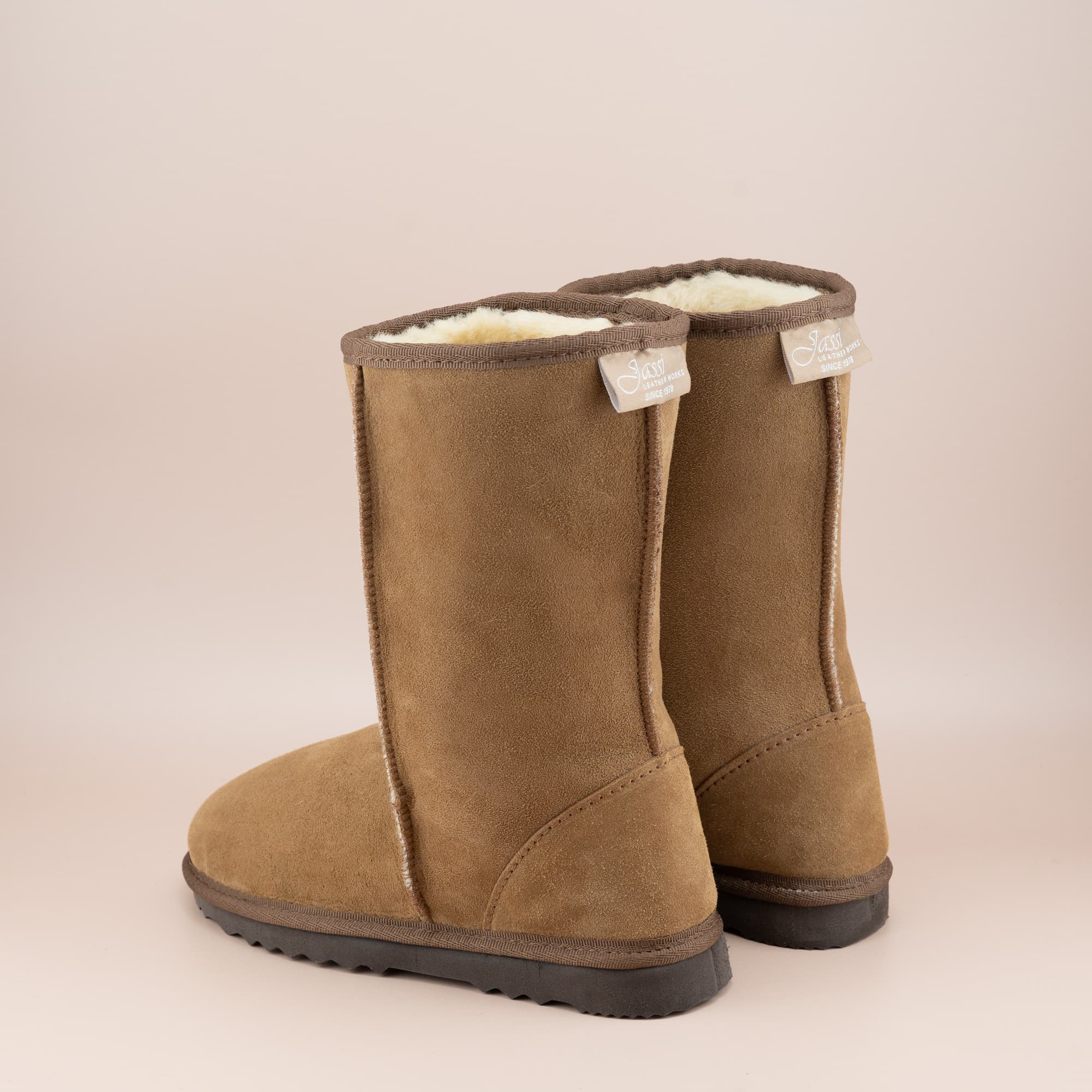 Kid's classic mid ugg boot in suede tan color, back view. #color_tan