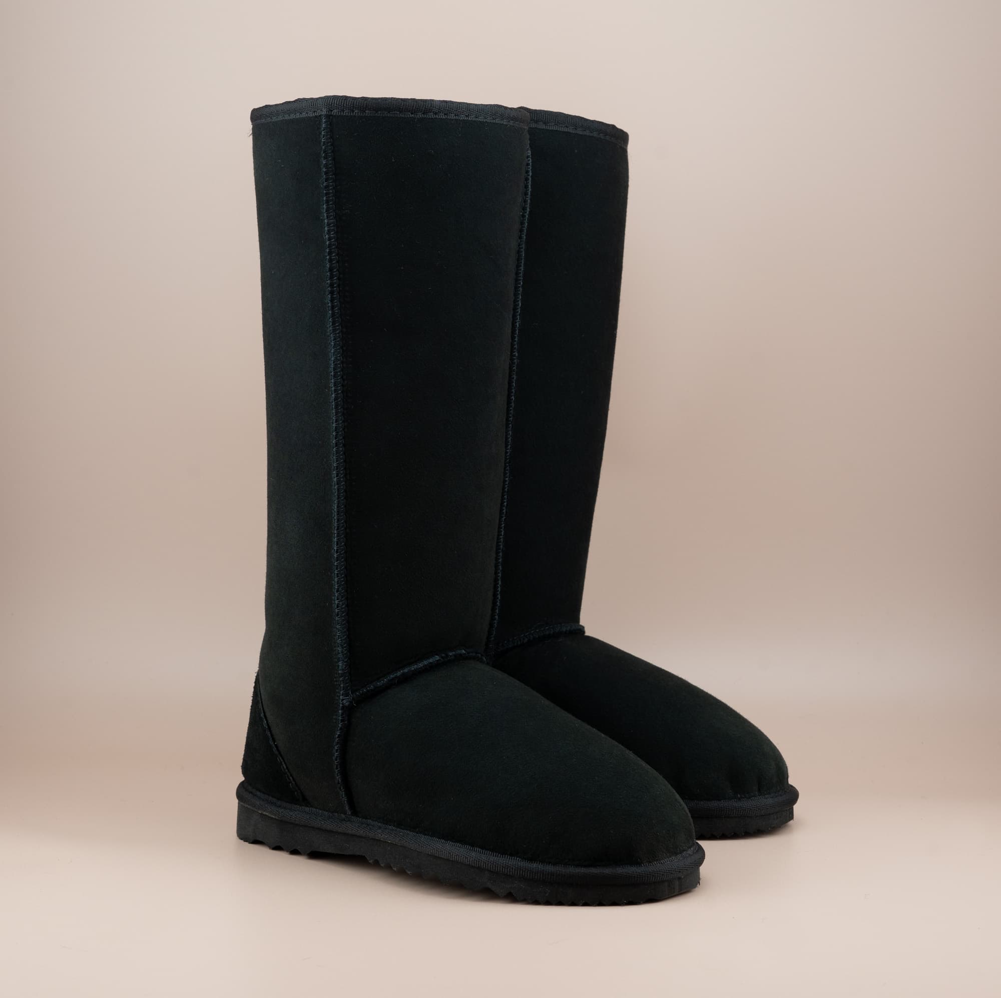 Men's long ugg boot in color black and soft suede finish, front side view. #color_black