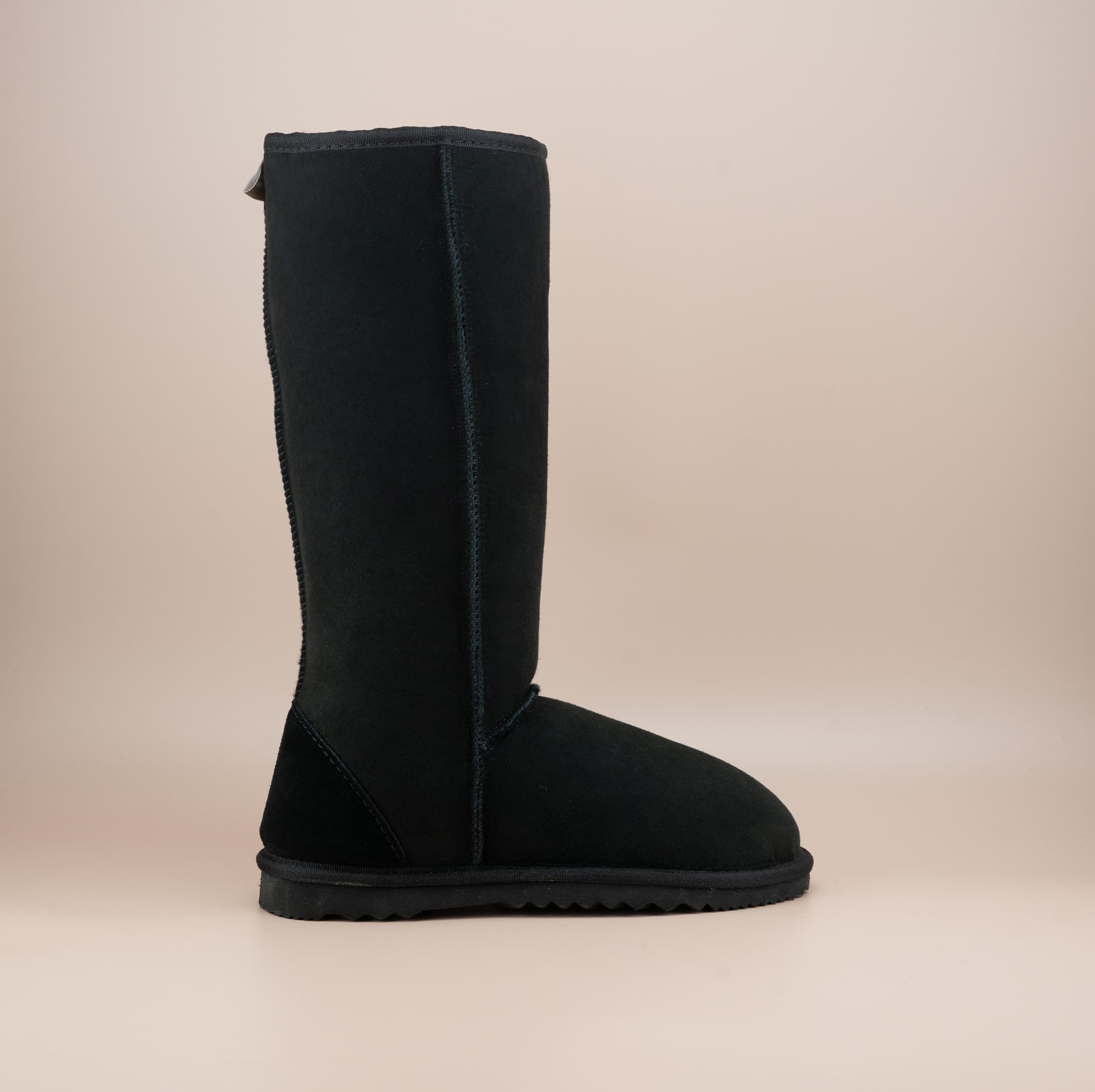 Men's long ugg boot in color black and soft suede finish, side view. #color_black