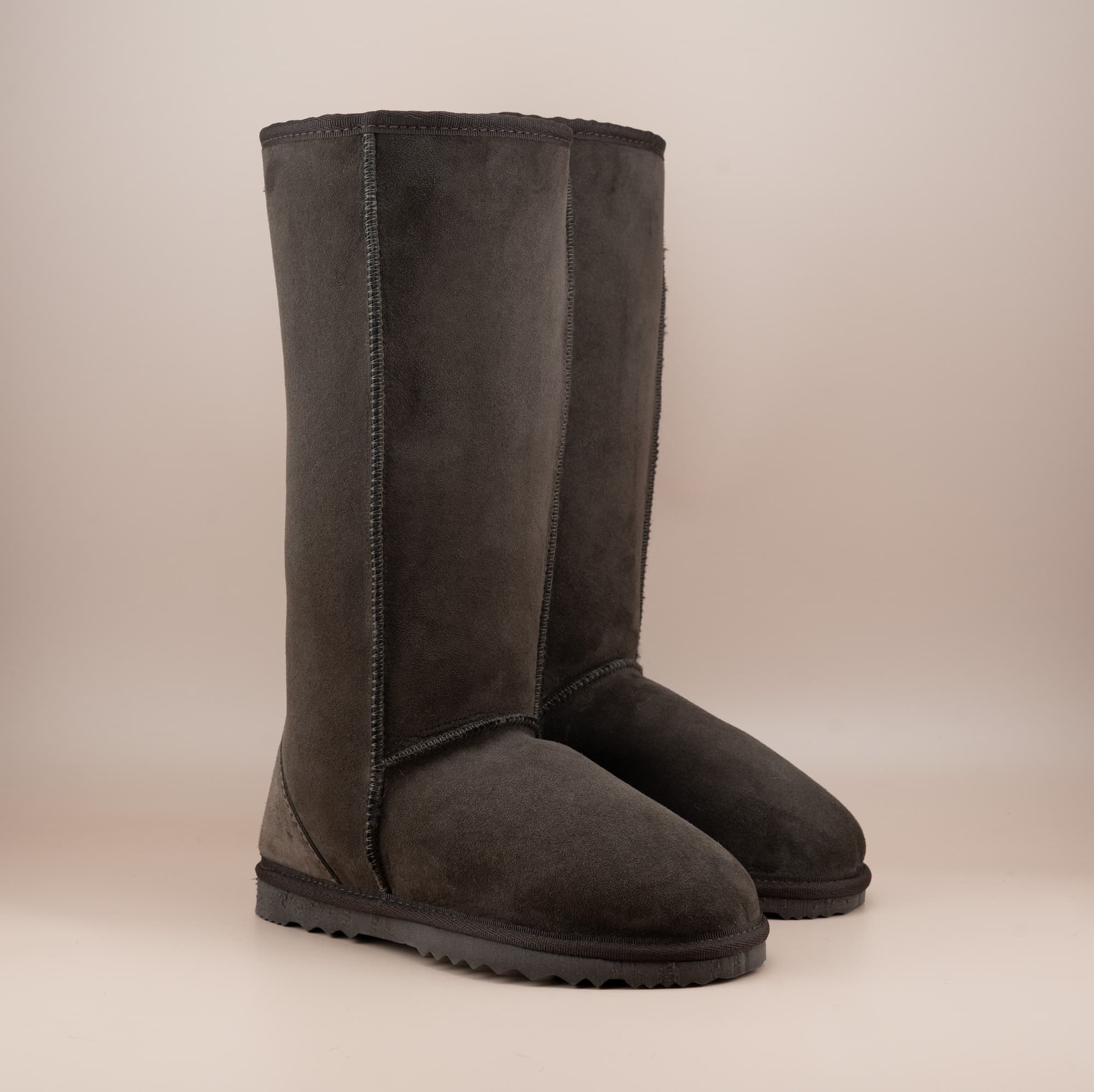 Men's long ugg boot in color chocolate and soft suede finish, front side view. #color_chocolate