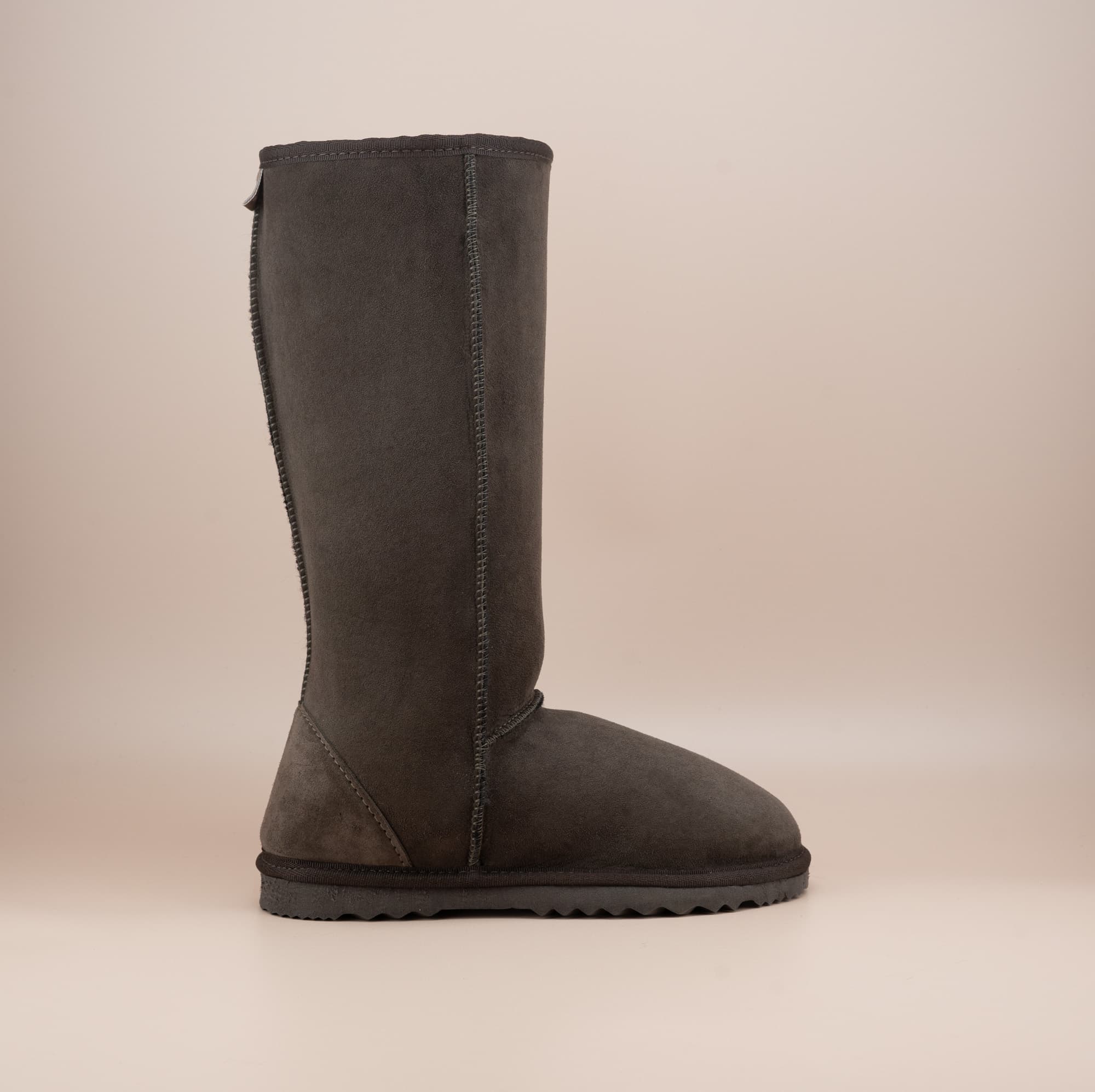 Men's long ugg boot in color chocolate and soft suede finish, side view. #color_chocolate