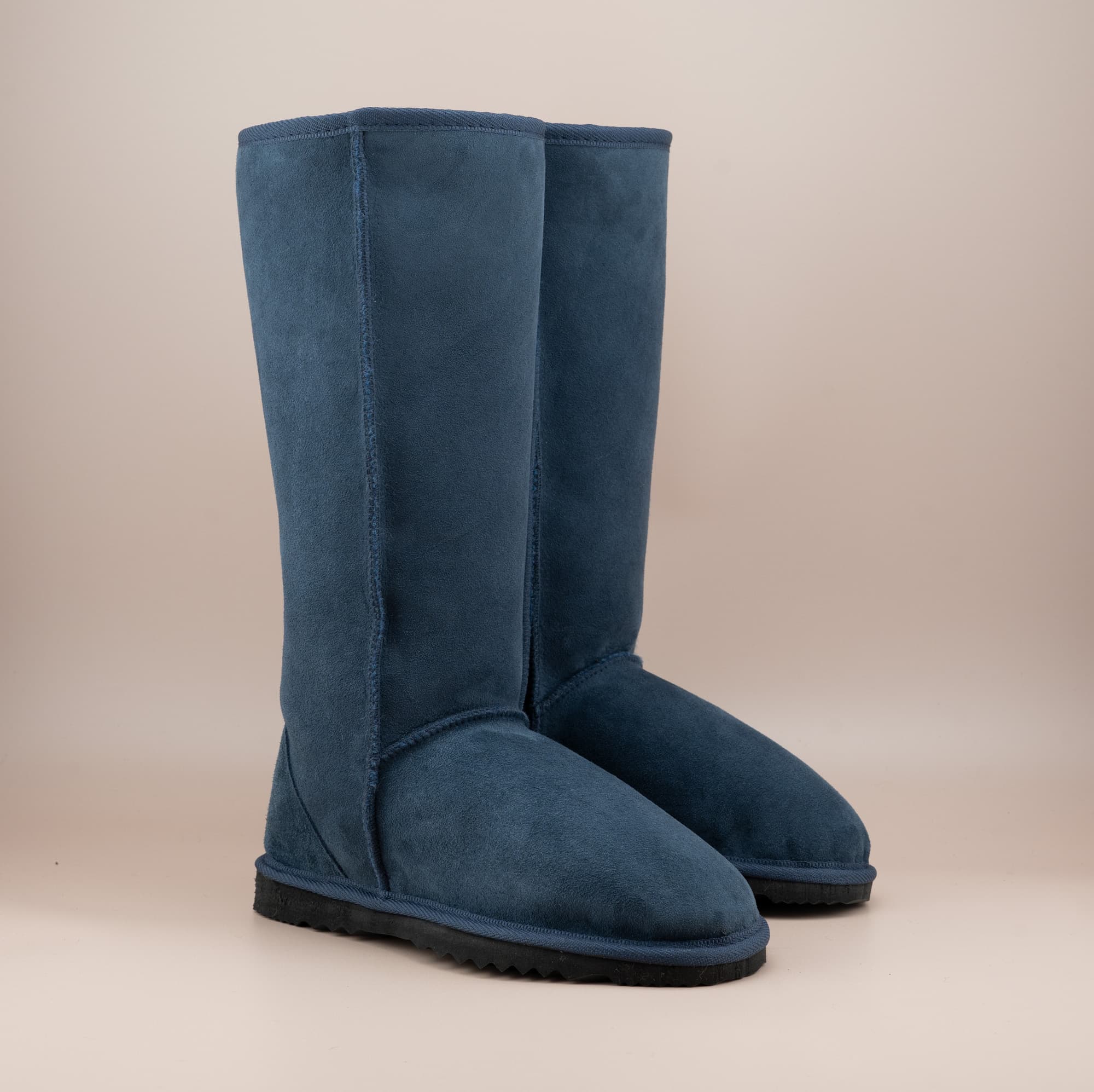 Men's long ugg boot in color navy and soft suede finish, front side view. #color_navy