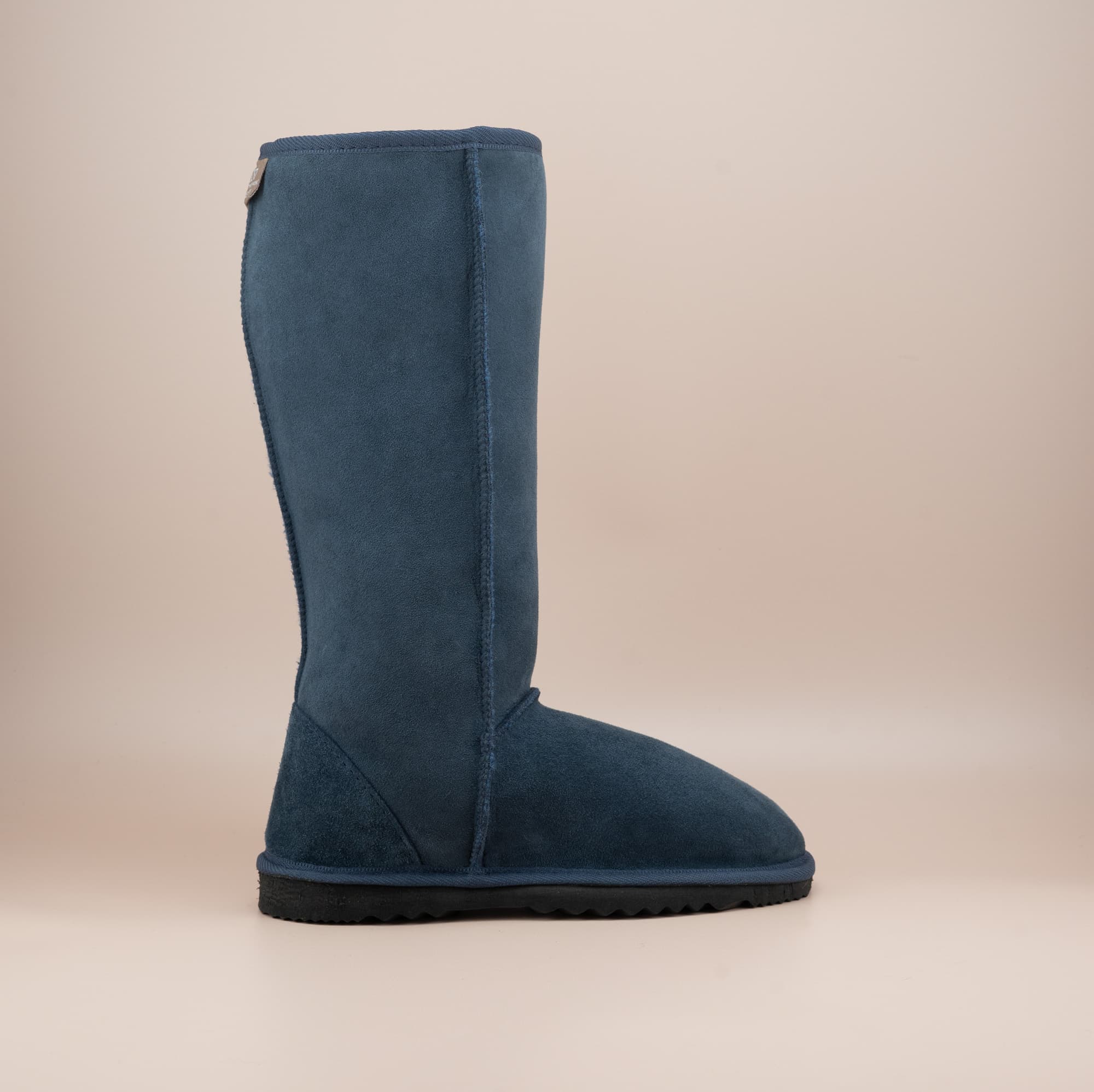 Men's long ugg boot in color navy and soft suede finish, side view. #color_navy