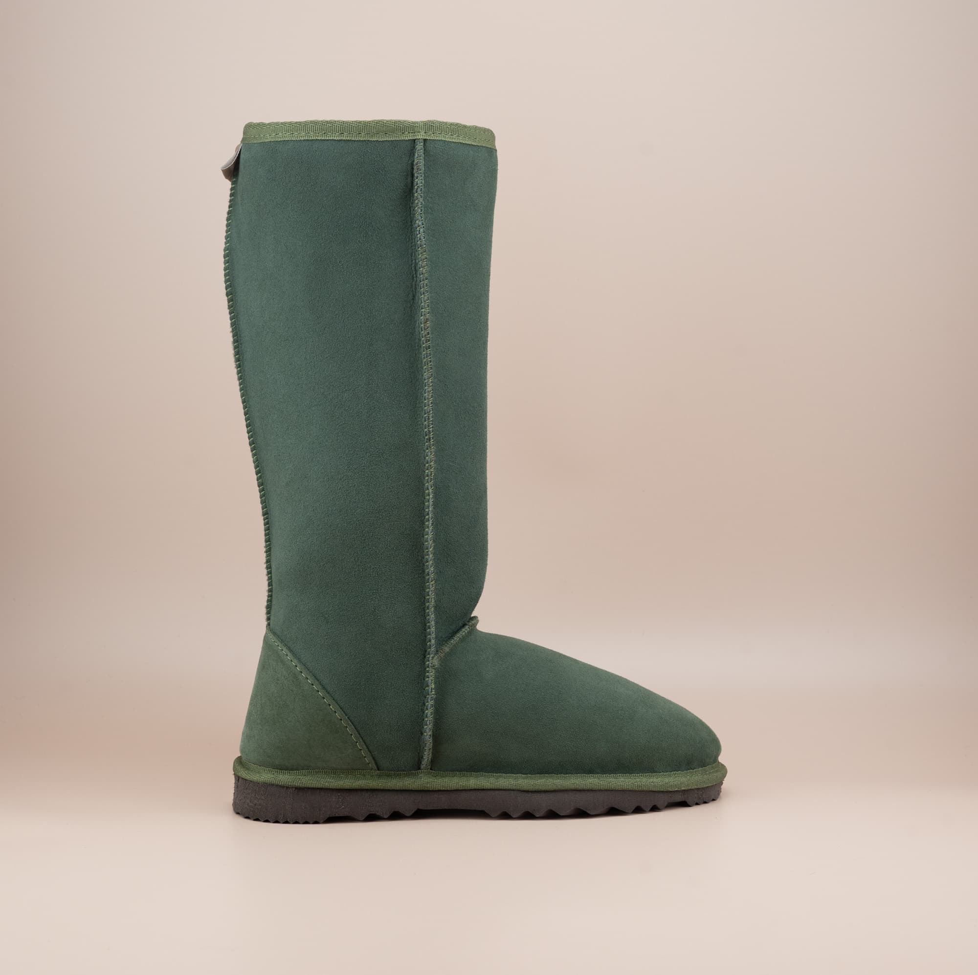 Men's long ugg boot in color olive and soft suede finish, side view. #color_olive