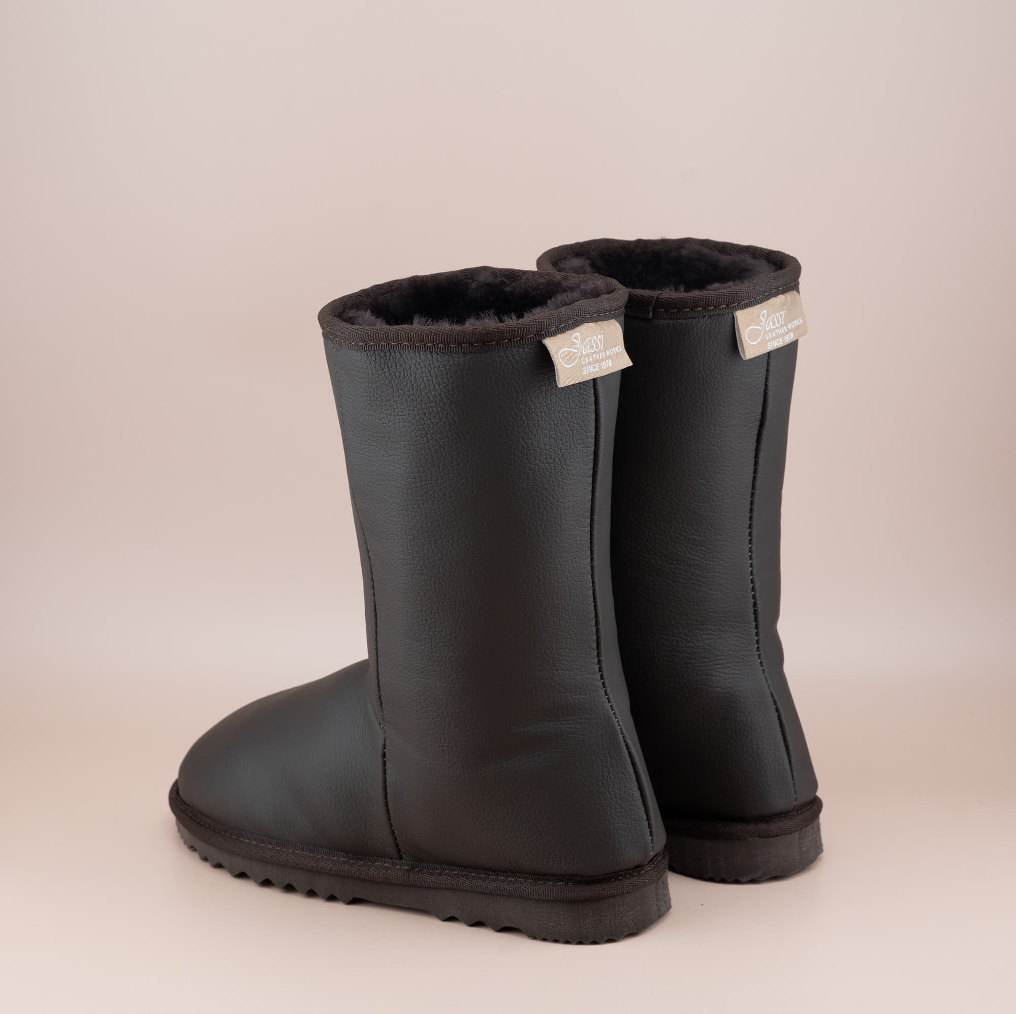 Men's Classic mid ugg boots in genuine leather finish and chocolate color, back view. #color_leather chocolate