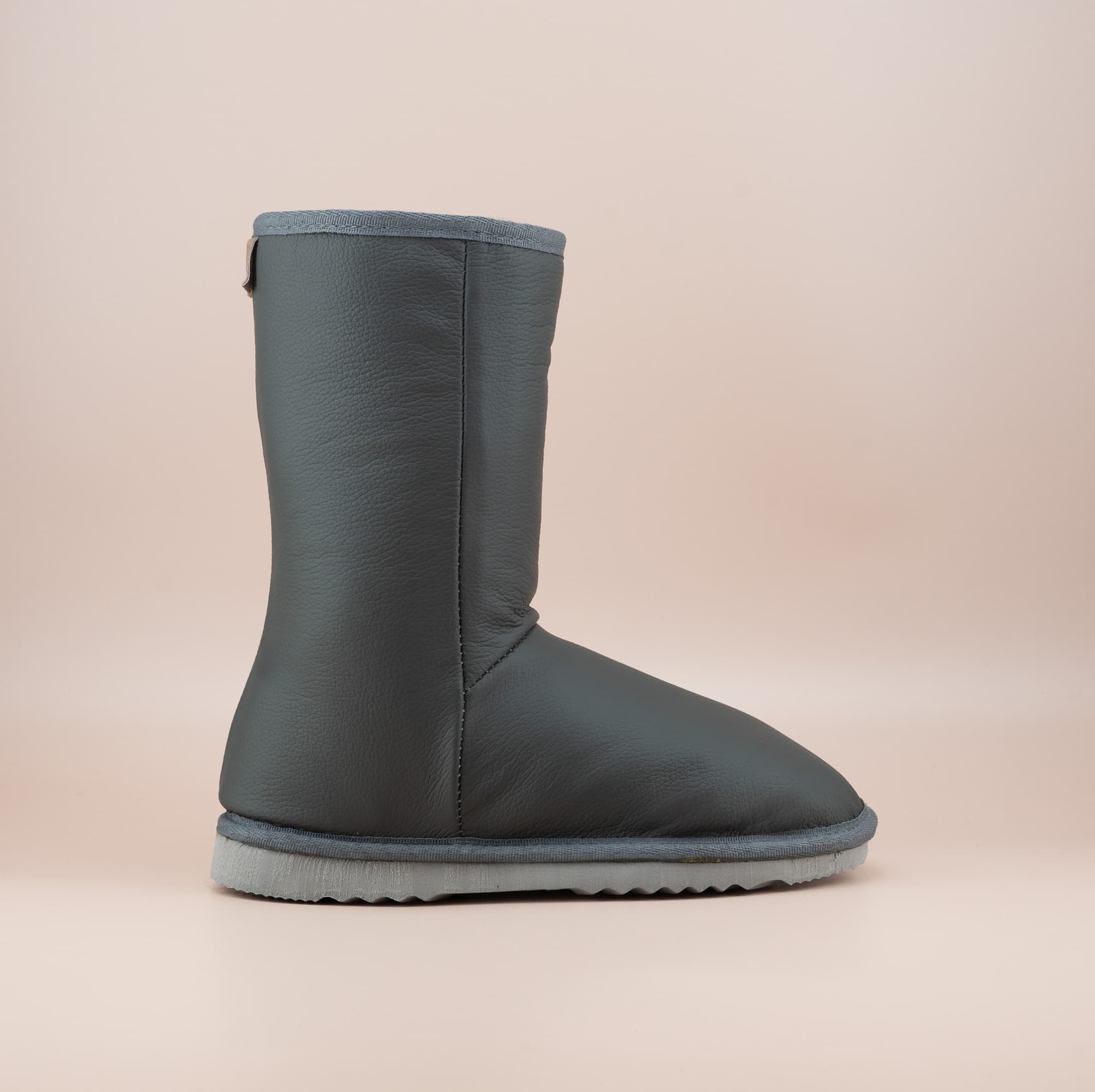 Men's Classic mid ugg boots in genuine leather finish and grey color, side view. #color_leather grey