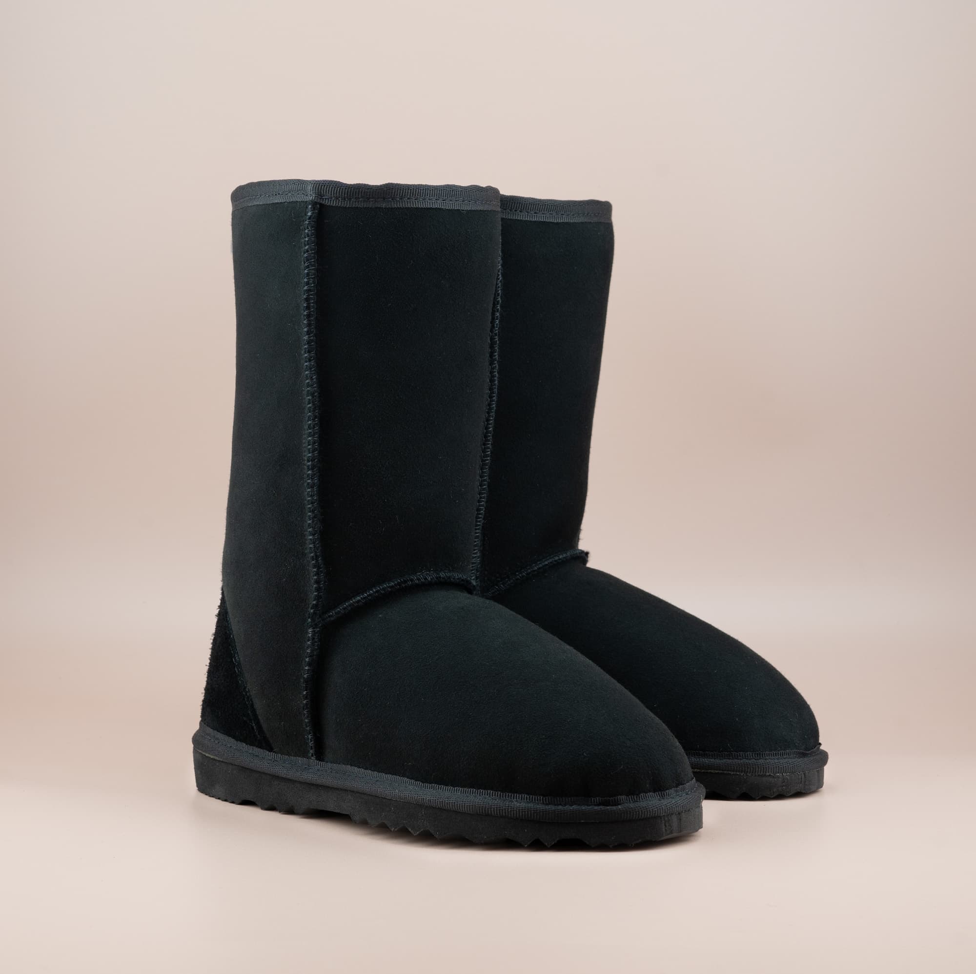 Men's mid ugg boot in color black and soft suede finish, front side view. #color_black