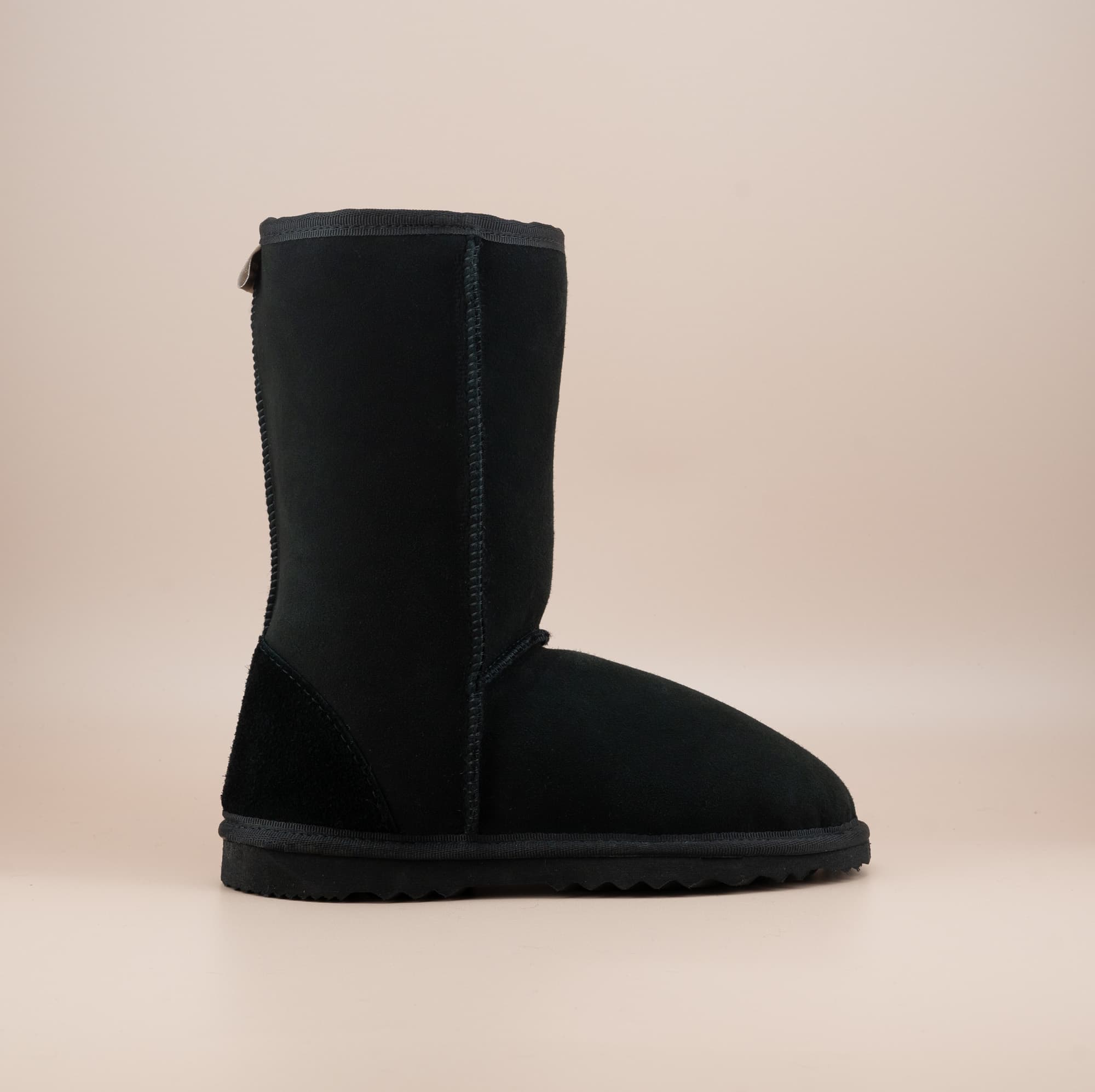 Men's mid ugg boot in color black and soft suede finish, side view. #color_black