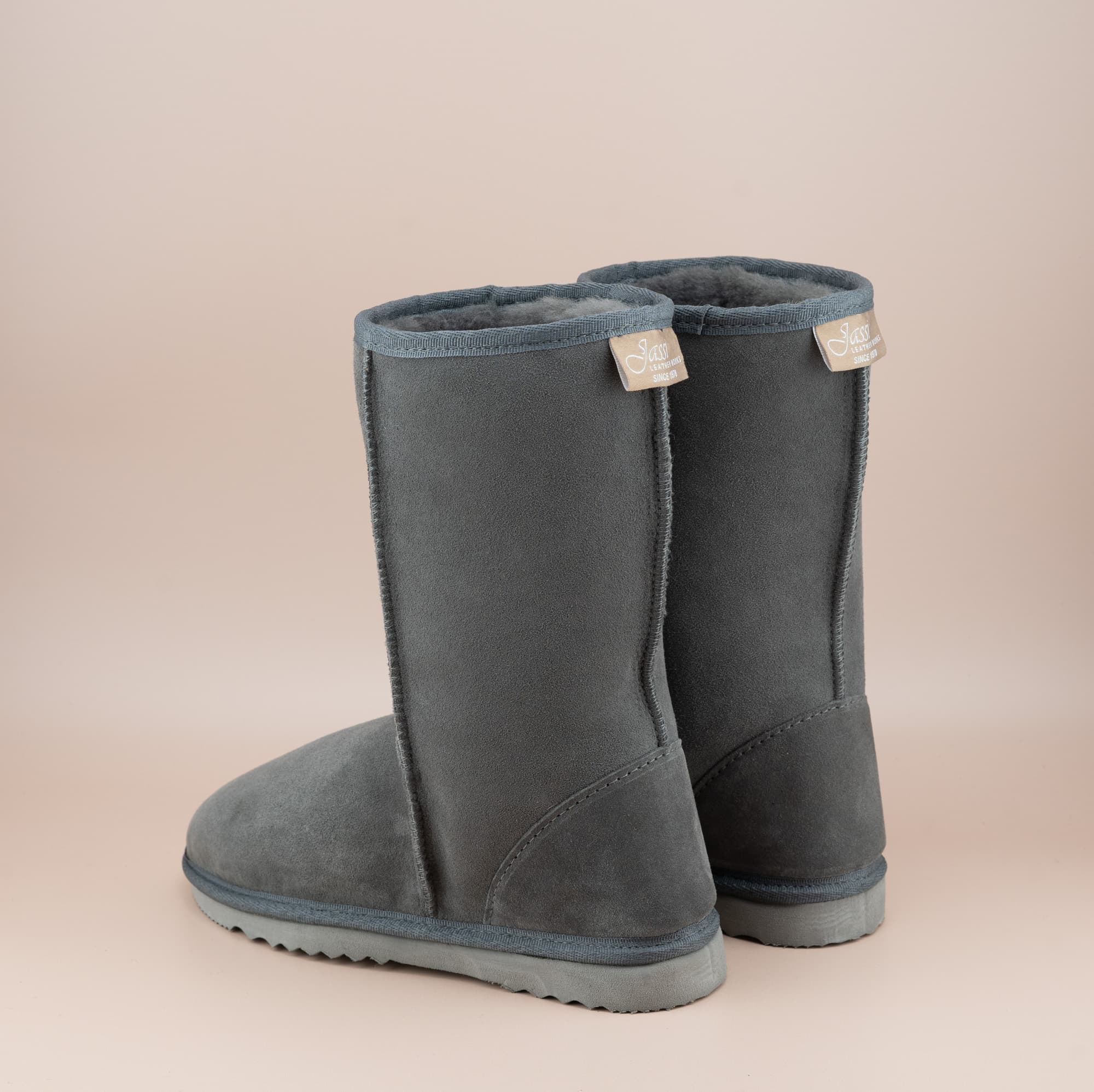 Men's mid ugg boot in color grey and soft suede finish, back view. #color_grey