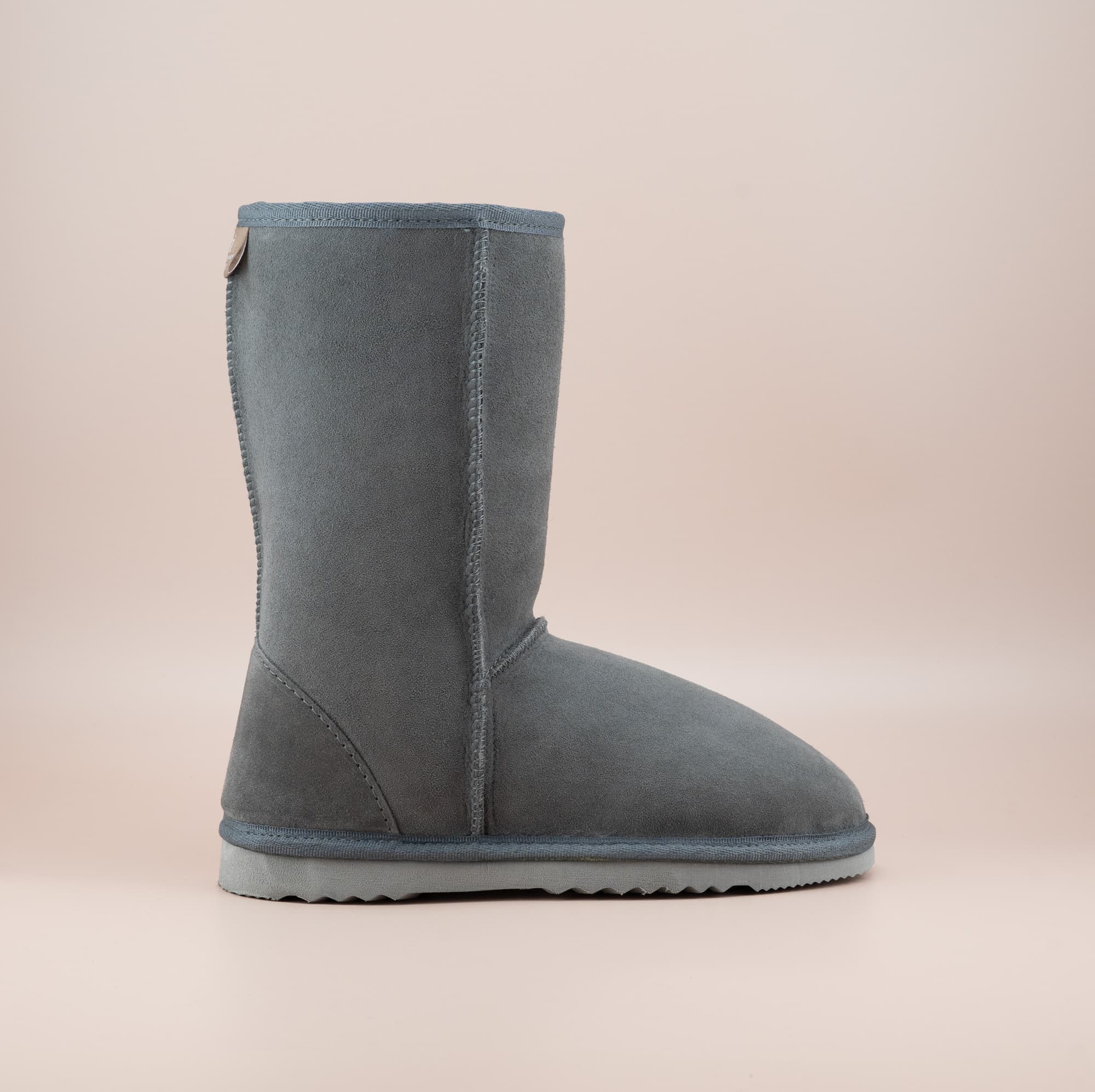 Men's mid ugg boot in color grey and soft suede finish, side view. #color_grey