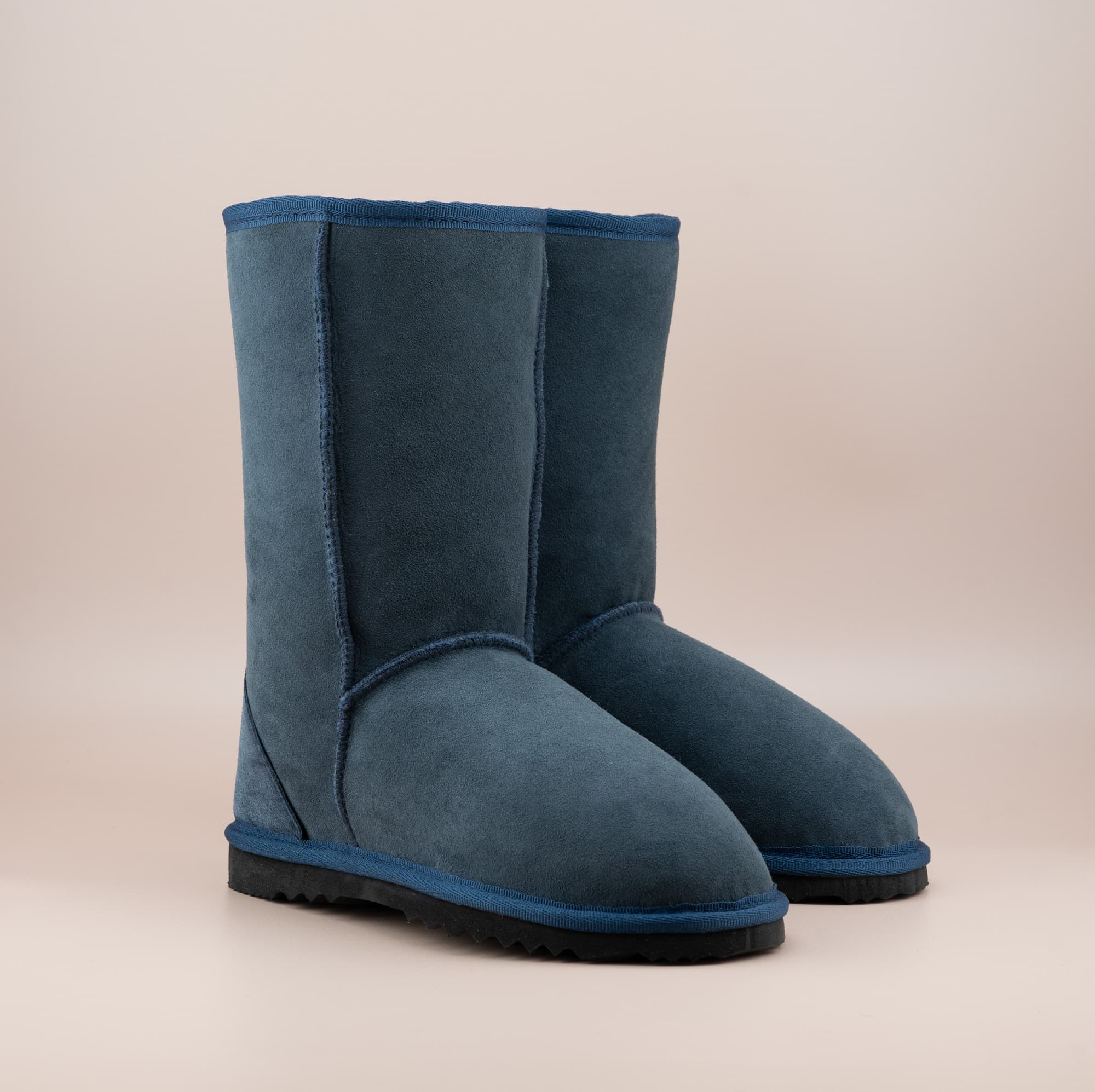 Men's mid ugg boot in color navy and soft suede finish, front side view. #color_navy