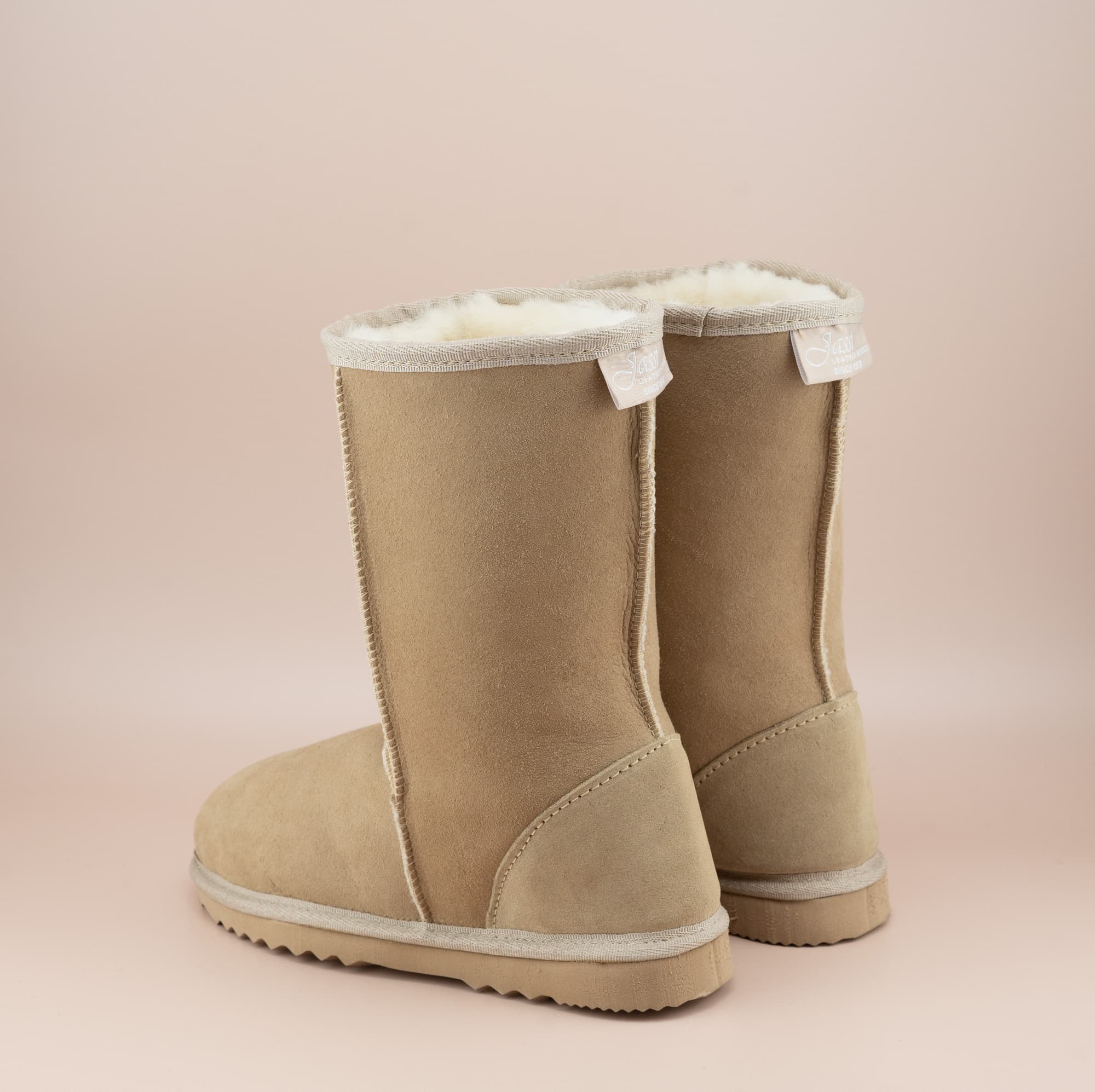 Men's mid ugg boot in color sand and soft suede finish, side view. #color_sand