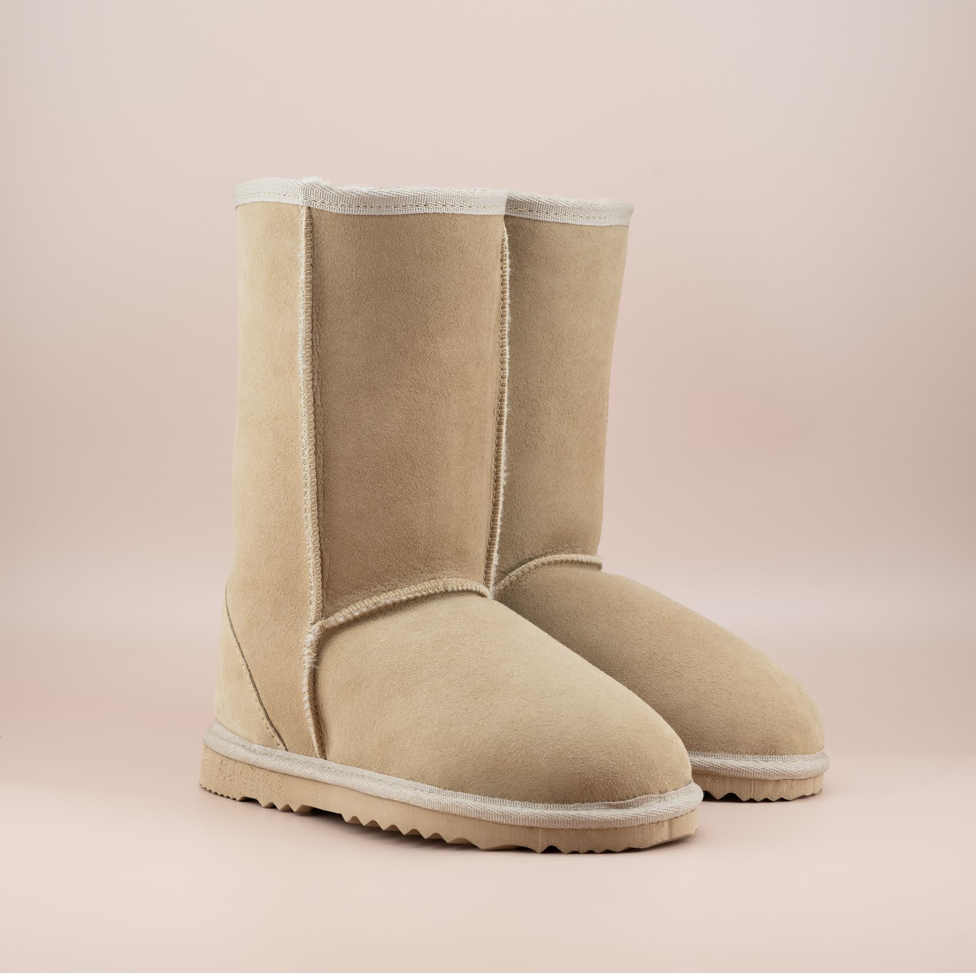 Men's mid ugg boot in color sand and soft suede finish, front side view. #color_sand