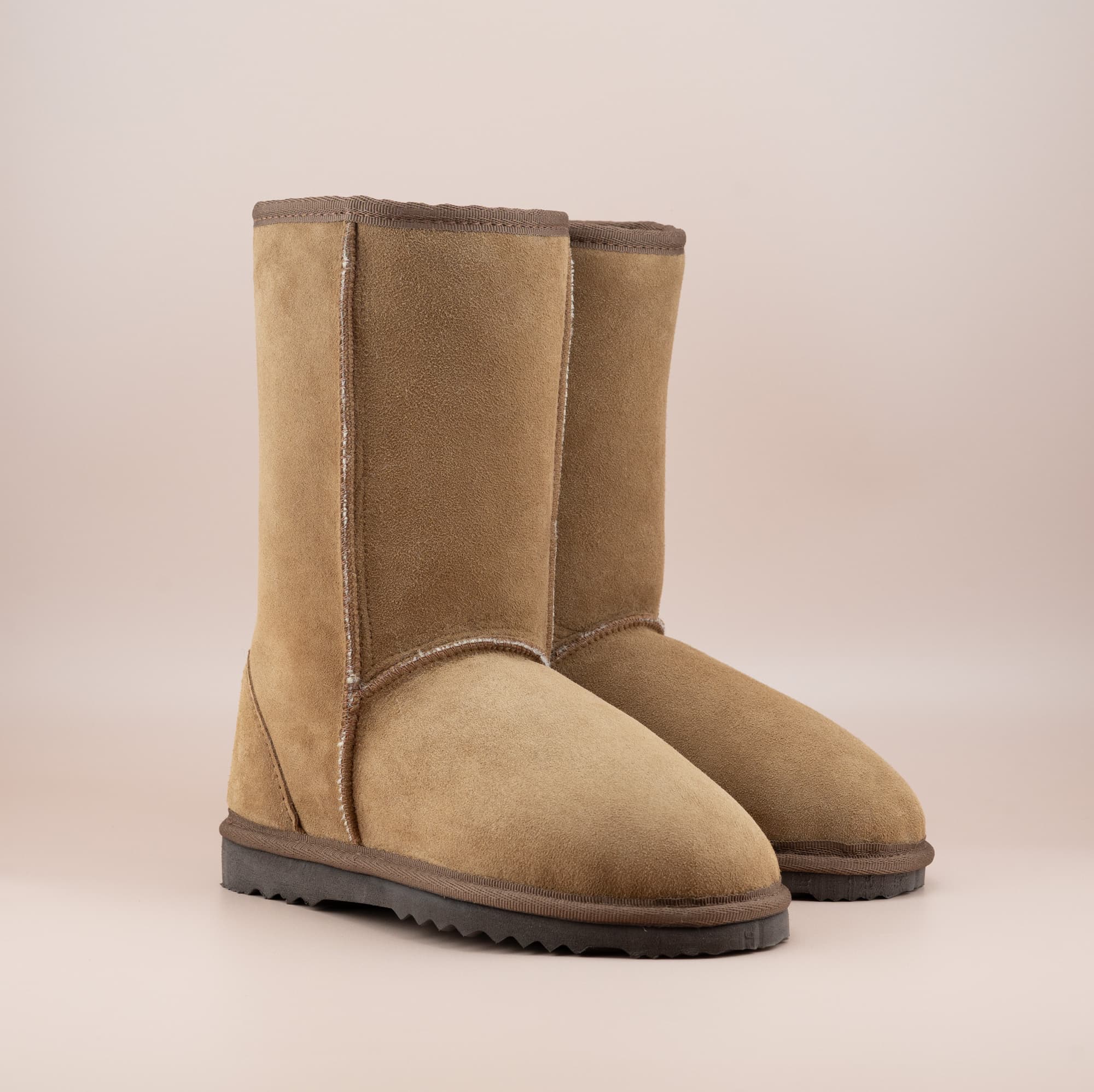 Men's mid ugg boot in color tan and soft suede finish, front side view. #color_tan