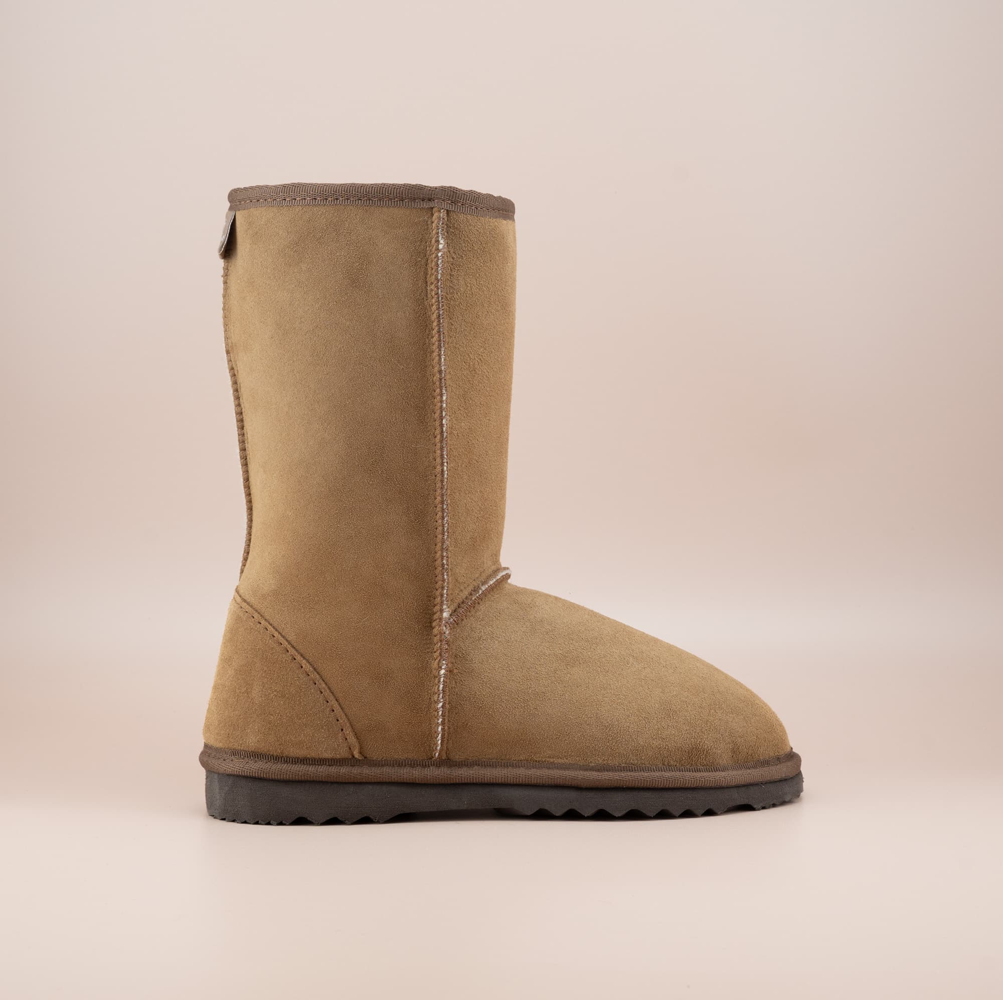 Men's mid ugg boot in color tan and soft suede finish, side view. #color_tan