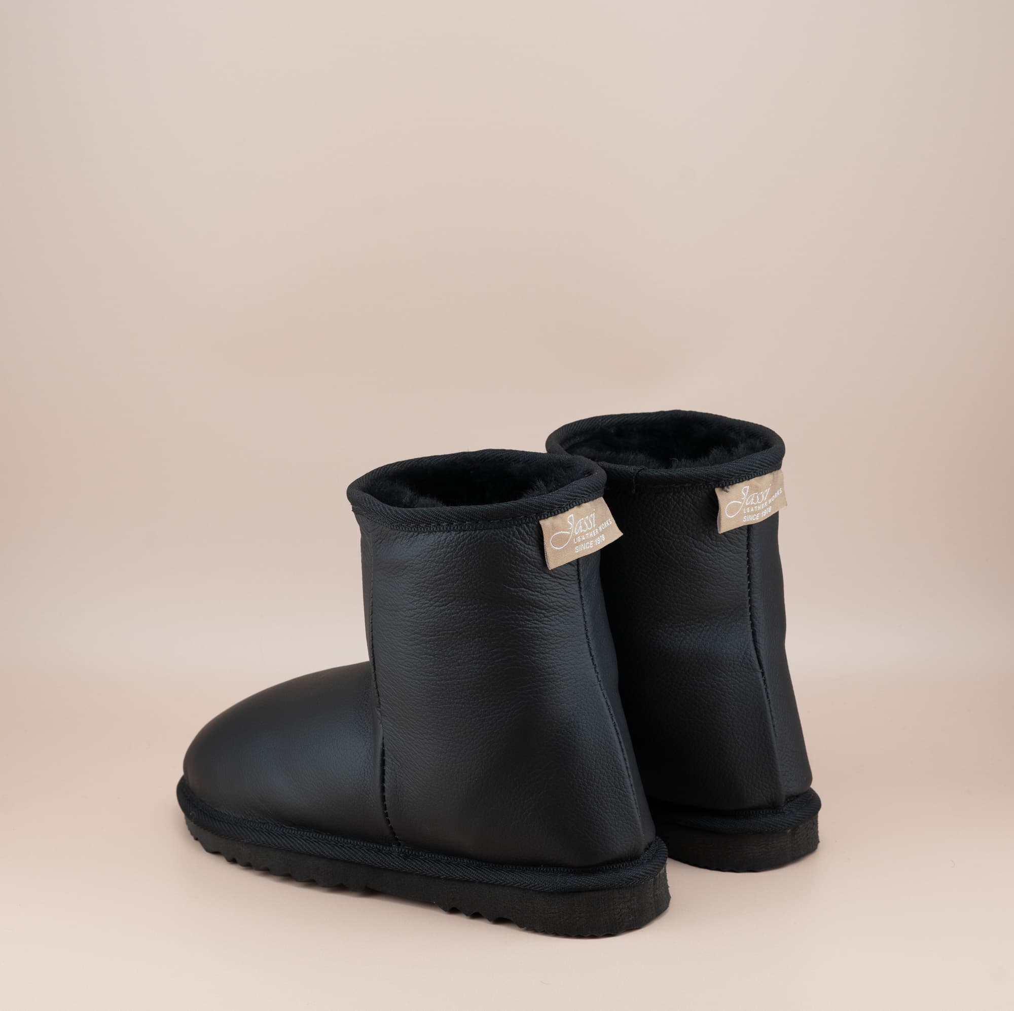 Men's Classic Short ugg boots in genuine leather finish and black color, black view. #color_leather black