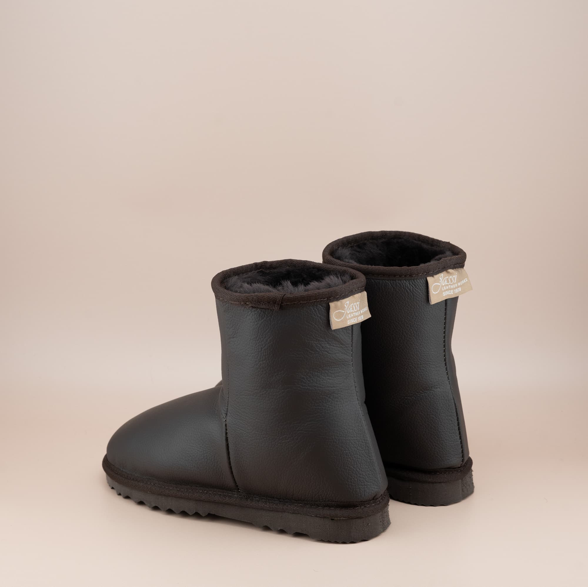 Men's Classic Short ugg boots in genuine leather finish and chocolate color, back view. #color_leather chocolate