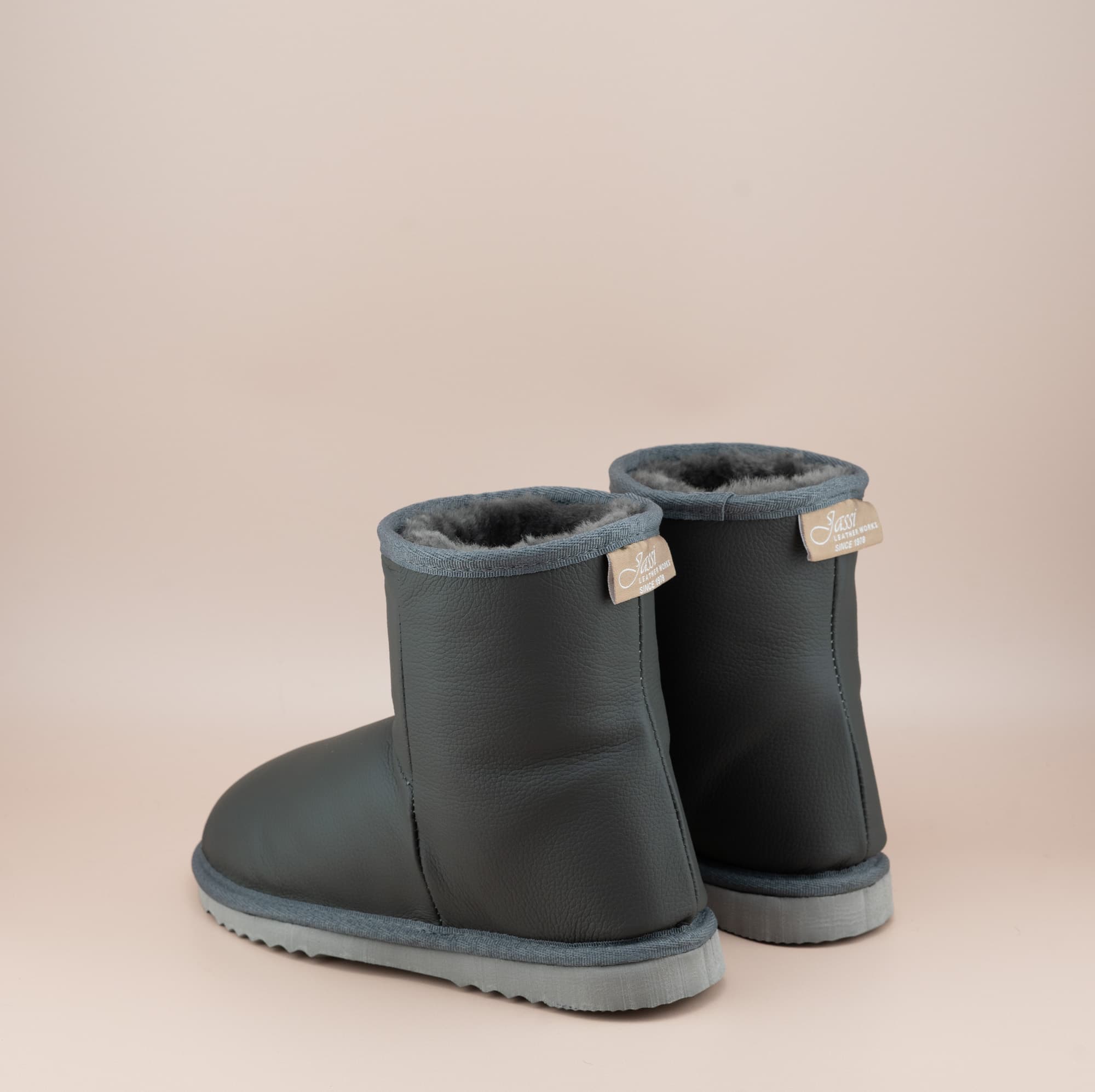 Men's Classic Short ugg boots in genuine leather finish and grey color, back view. #color_leather grey