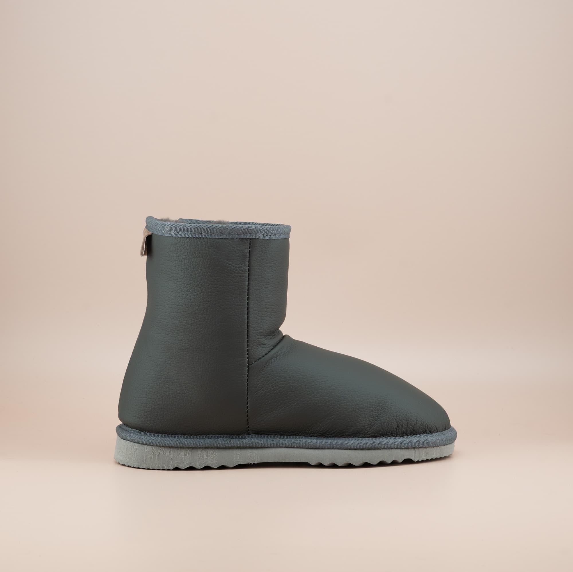 Men's Classic Short ugg boots in genuine leather finish and grey color, side view. #color_leather grey