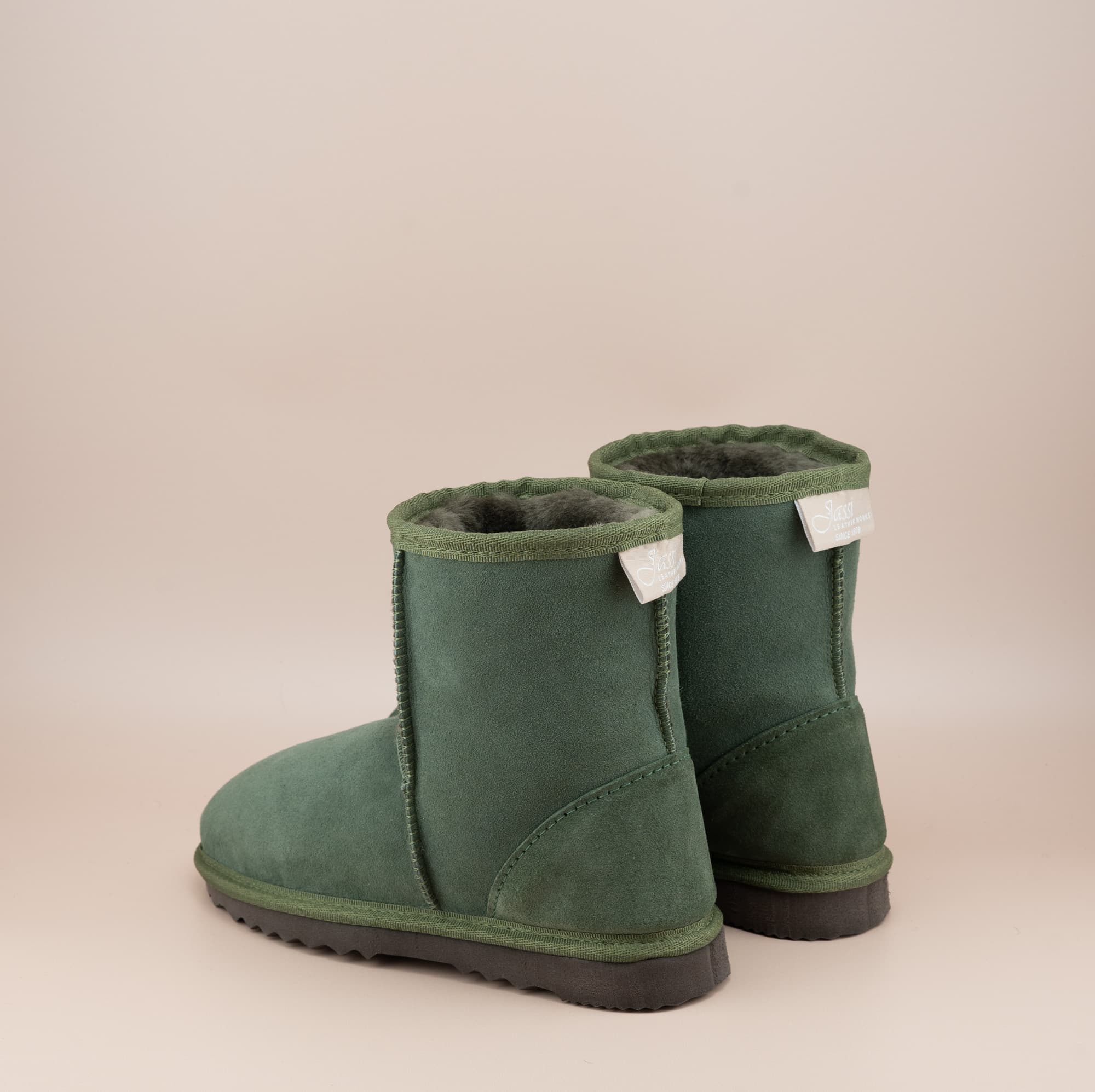 Men's short ugg boot in color olive and soft suede finish, side view. #color_olive