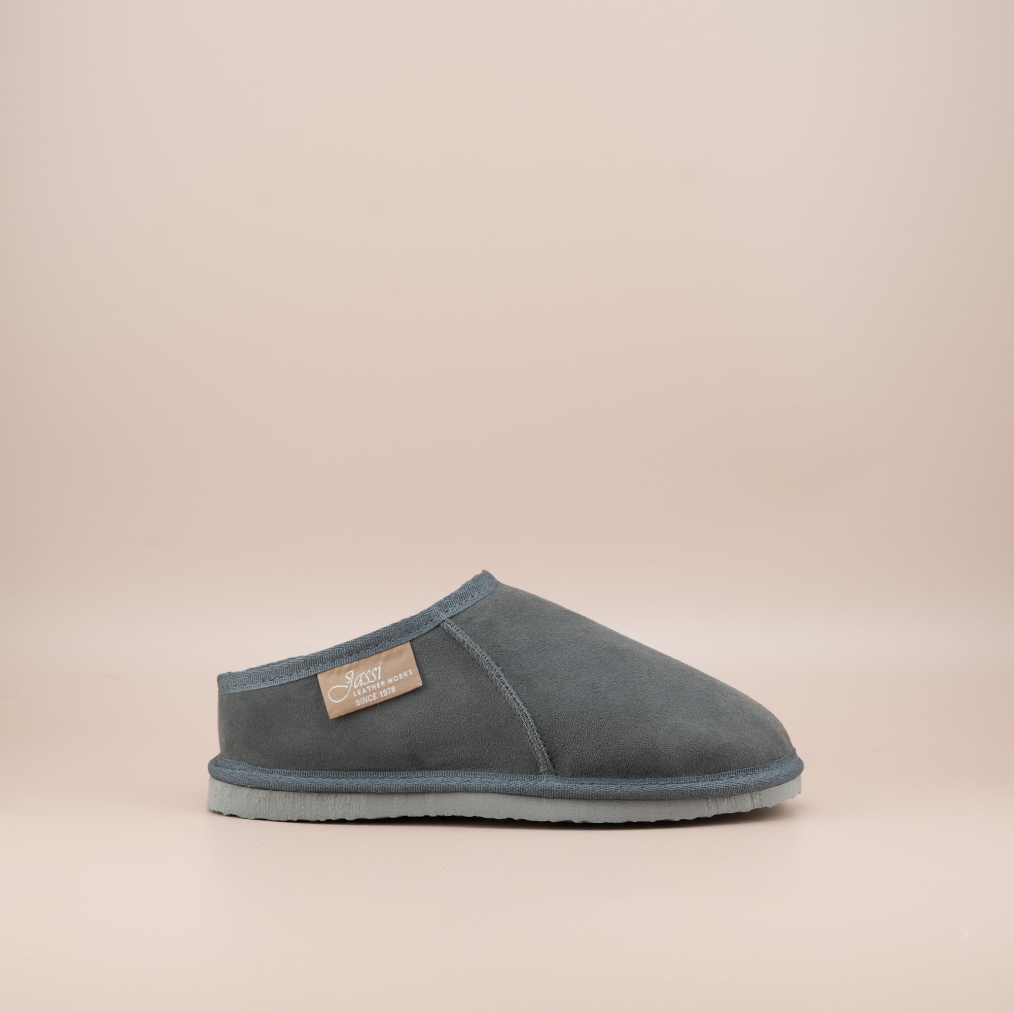 Men's ugg mewels with a suede finish in grey, side view. #color_grey