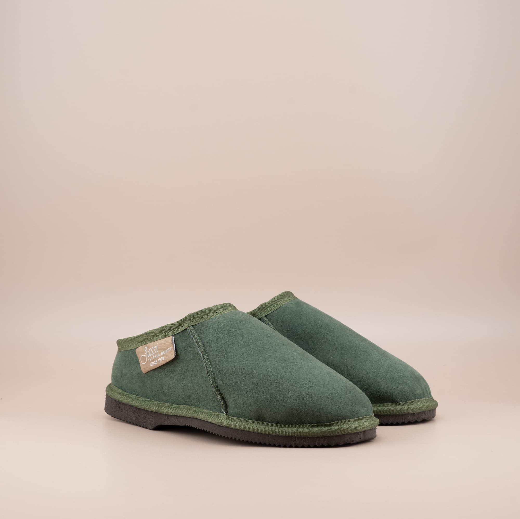 Men's ugg mewels with a suede finish in olive, front side view. #color_olive