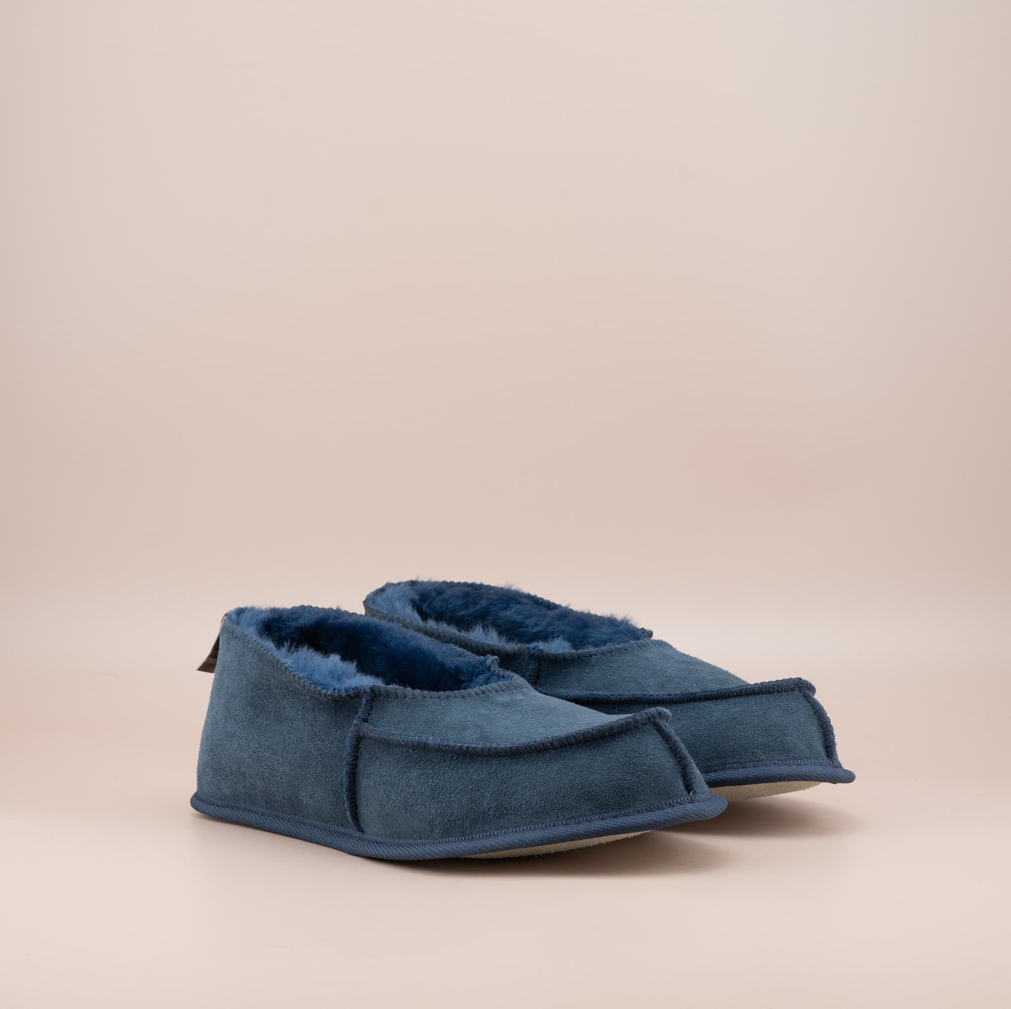 Men's ugg moccasins with a suede finish in navy, side view. #color_navy