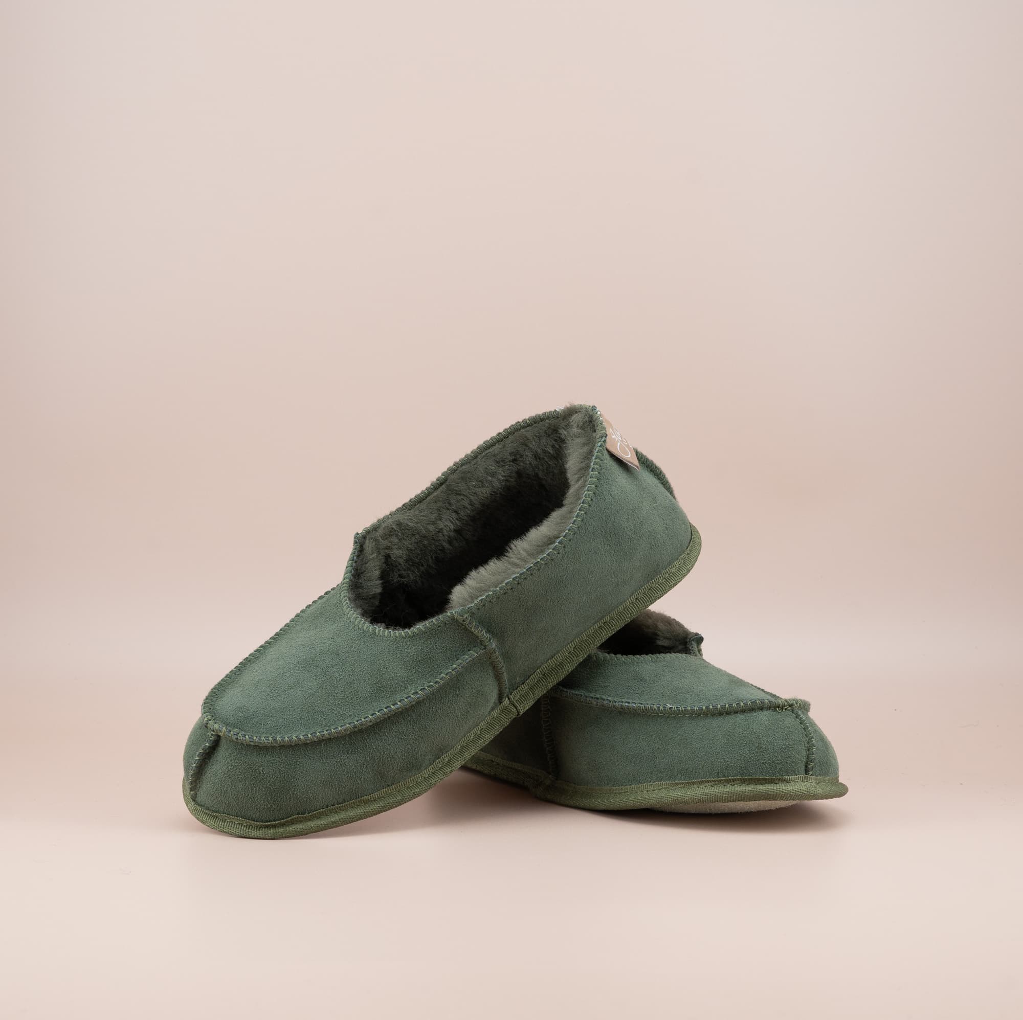 Men's ugg moccasins with a suede finish in olive, front and side view. #color_olive