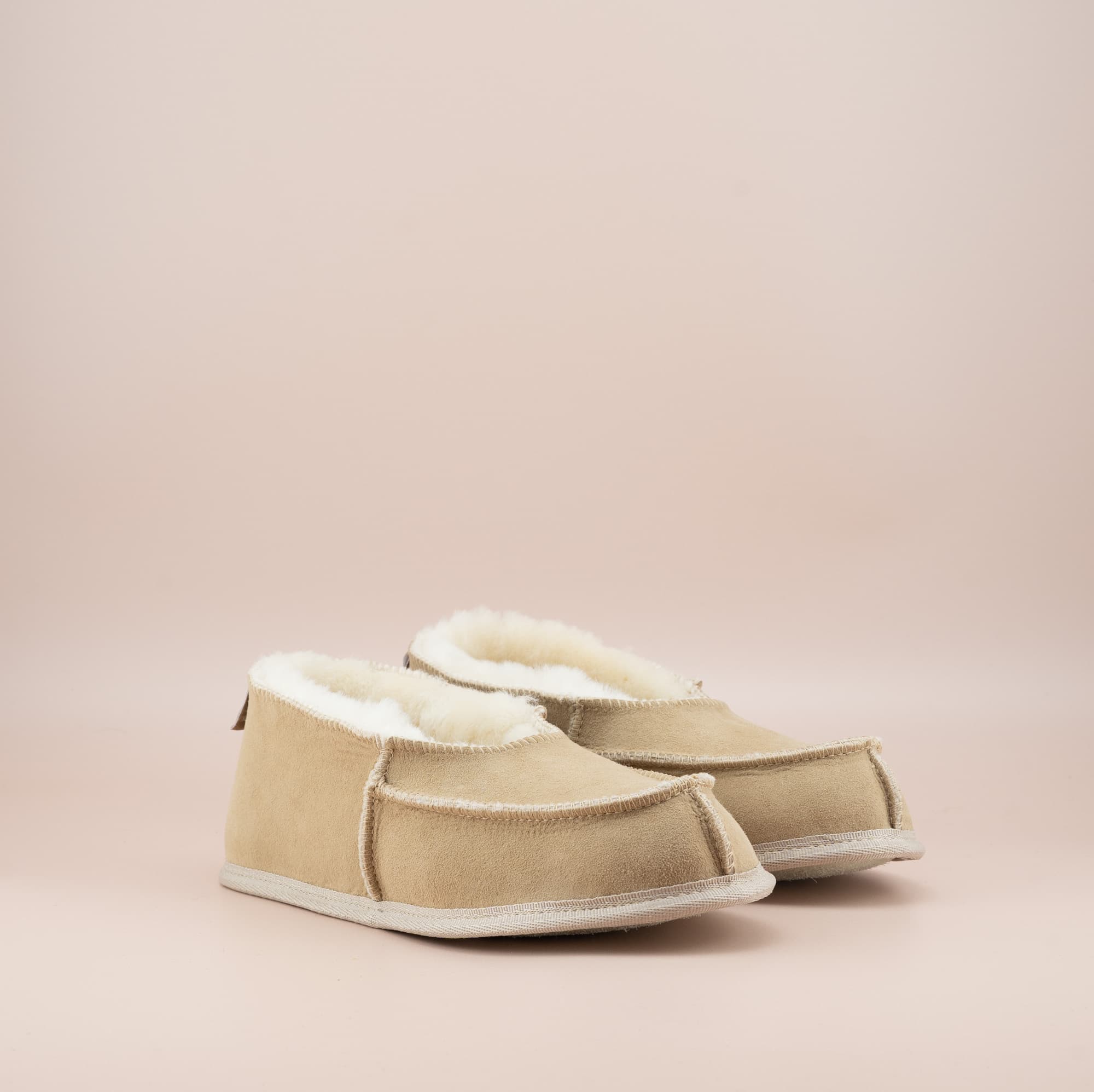 Men's ugg moccasins with a suede finish in sand, side view. #color_sand