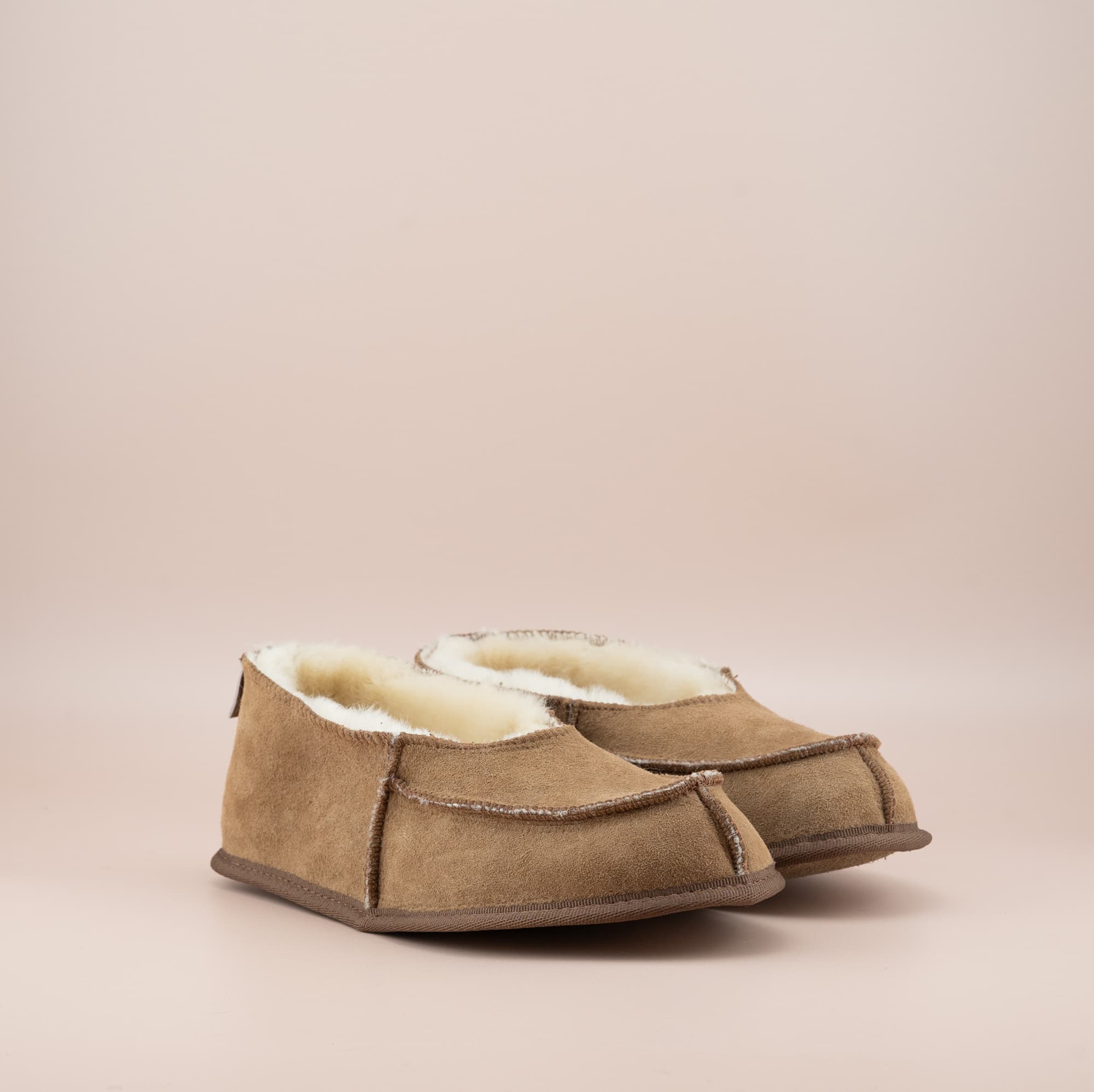 Men's ugg moccasins with a suede finish in tan, side view. #color_tan