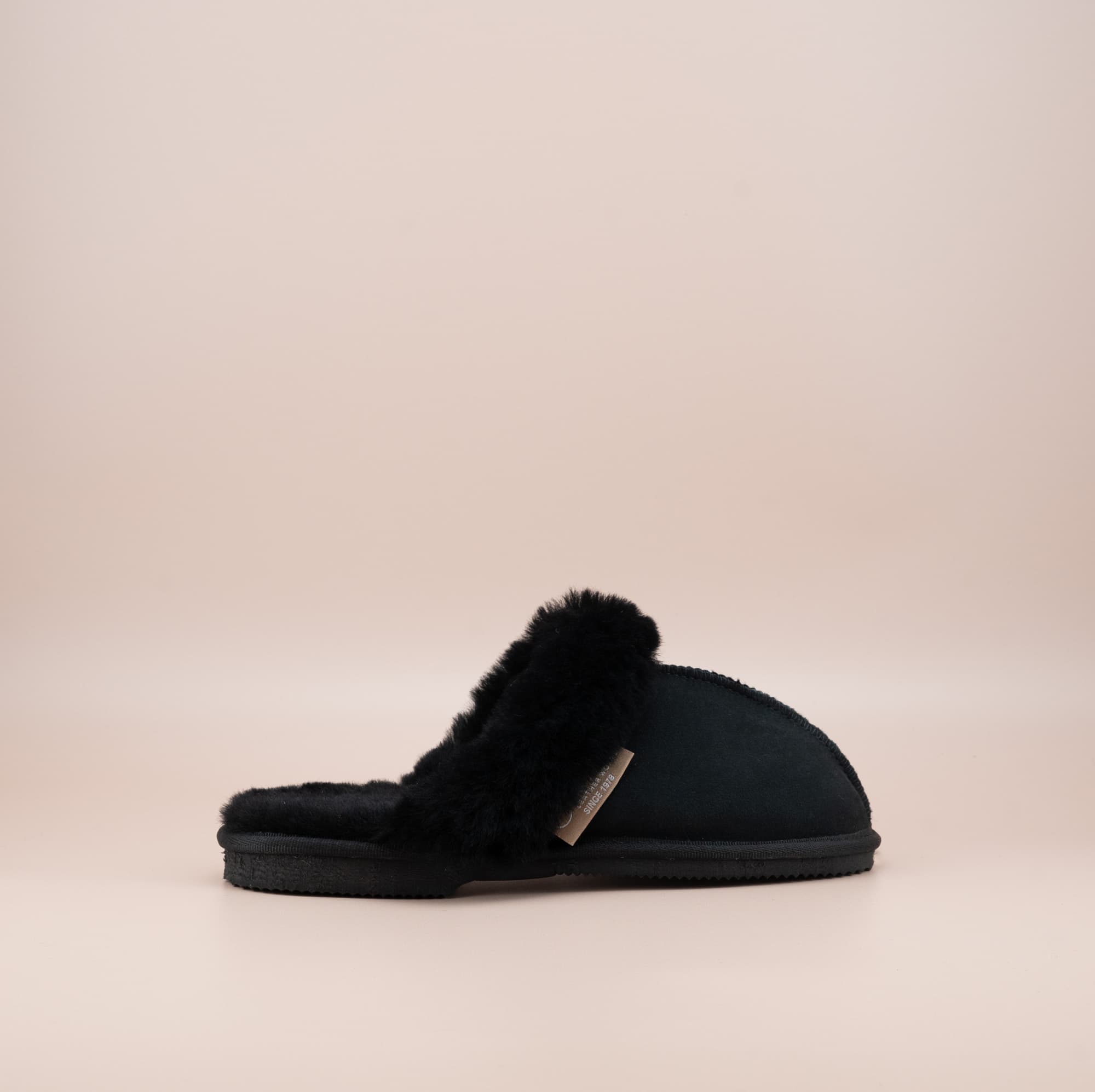 Men's ugg scuffs with a suede finish in black and wool turn, outer side view. #color_black