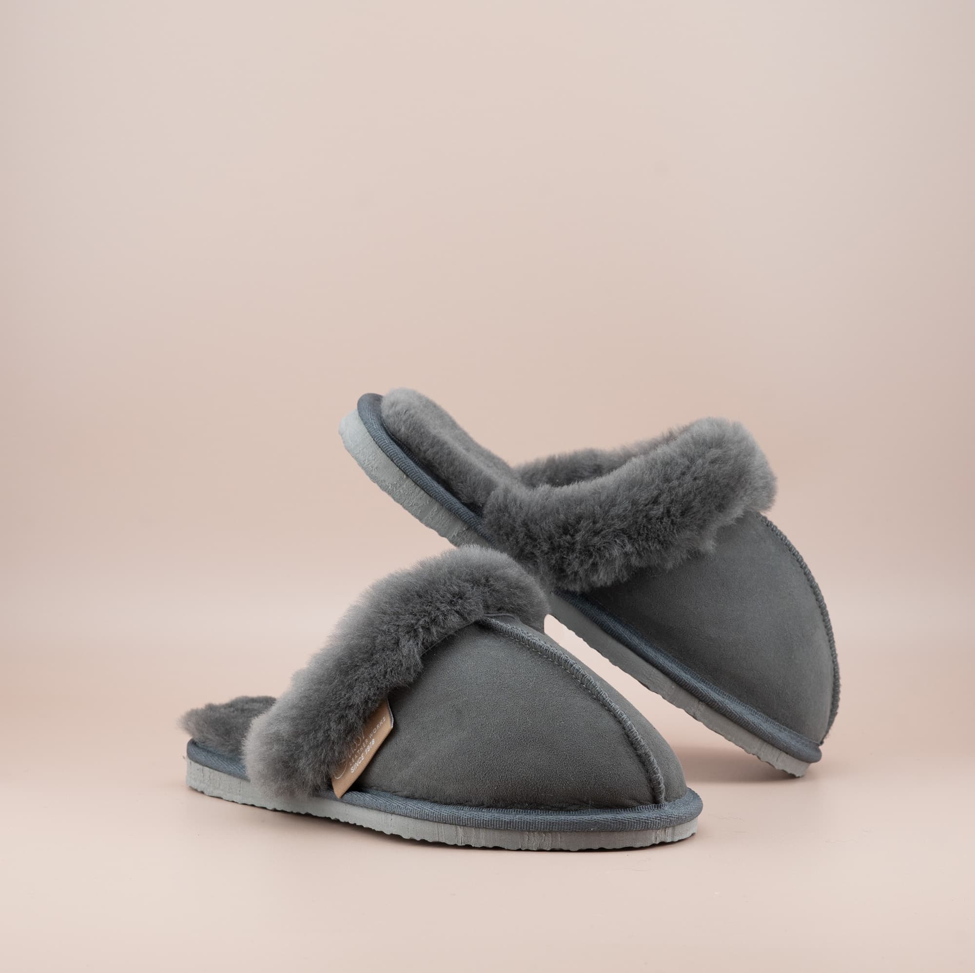 Men's ugg scuffs with a suede finish in grey and wool turn, front and inside view of the pair. #color_grey