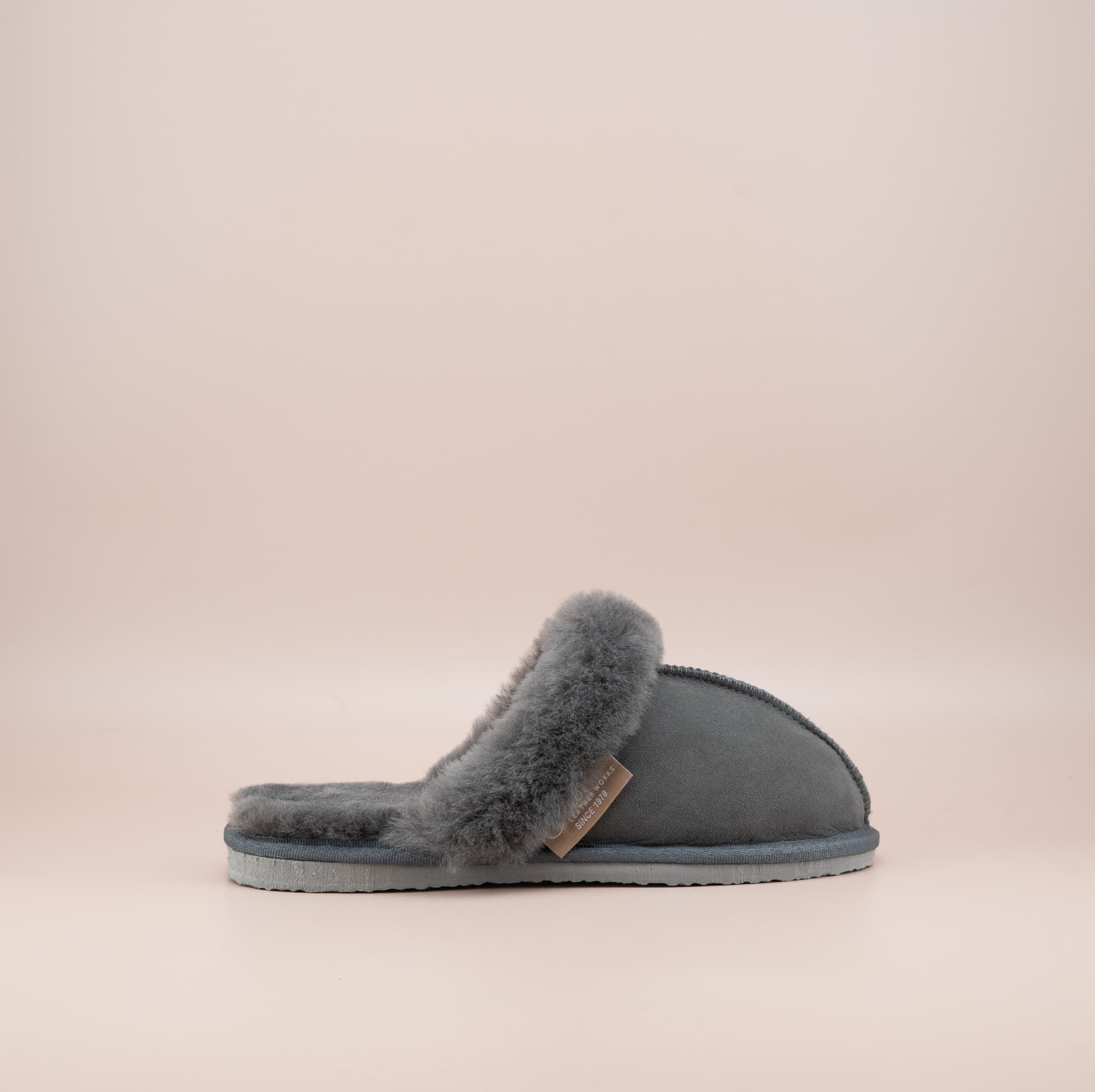 Men's ugg scuffs with a suede finish in grey and wool turn, single outer side view. #color_grey