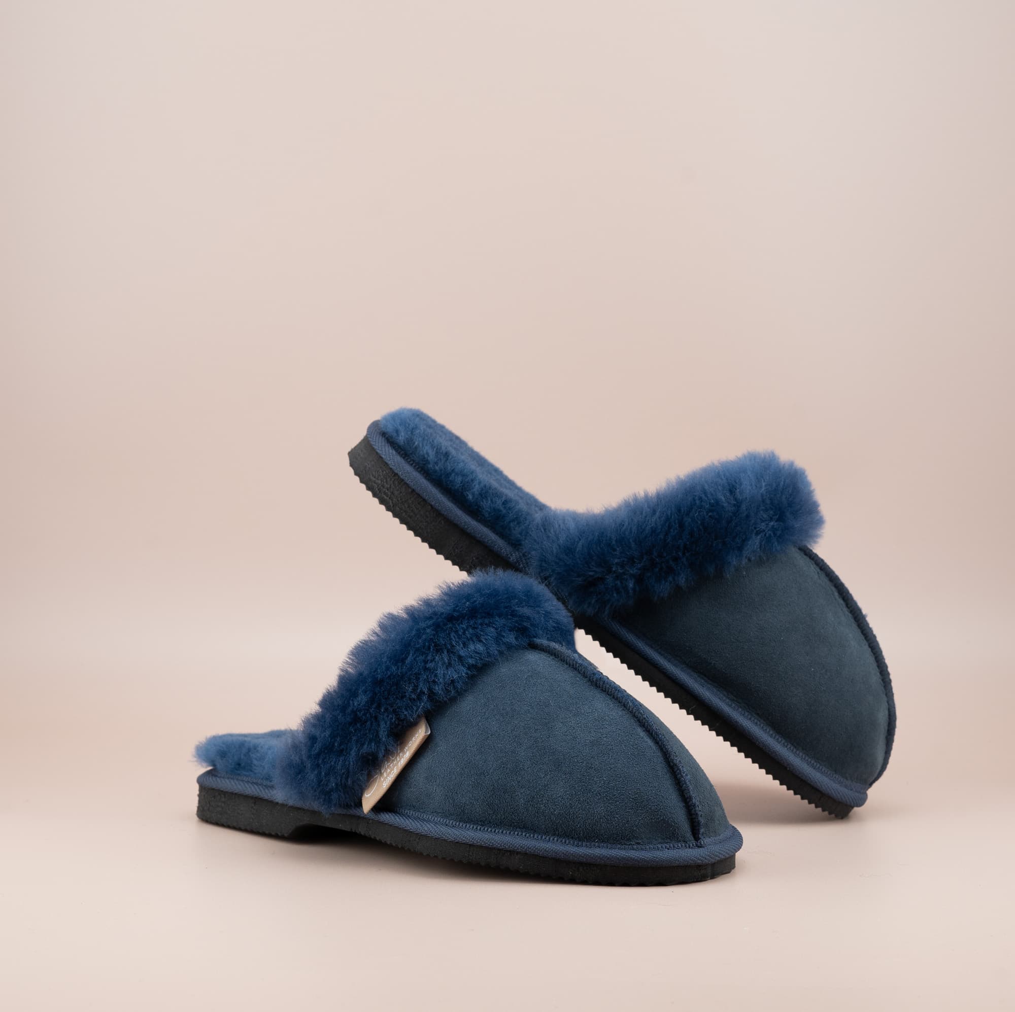 Men's ugg scuffs with a suede finish in navy and wool turn, front and inside view of the pair. #color_navy