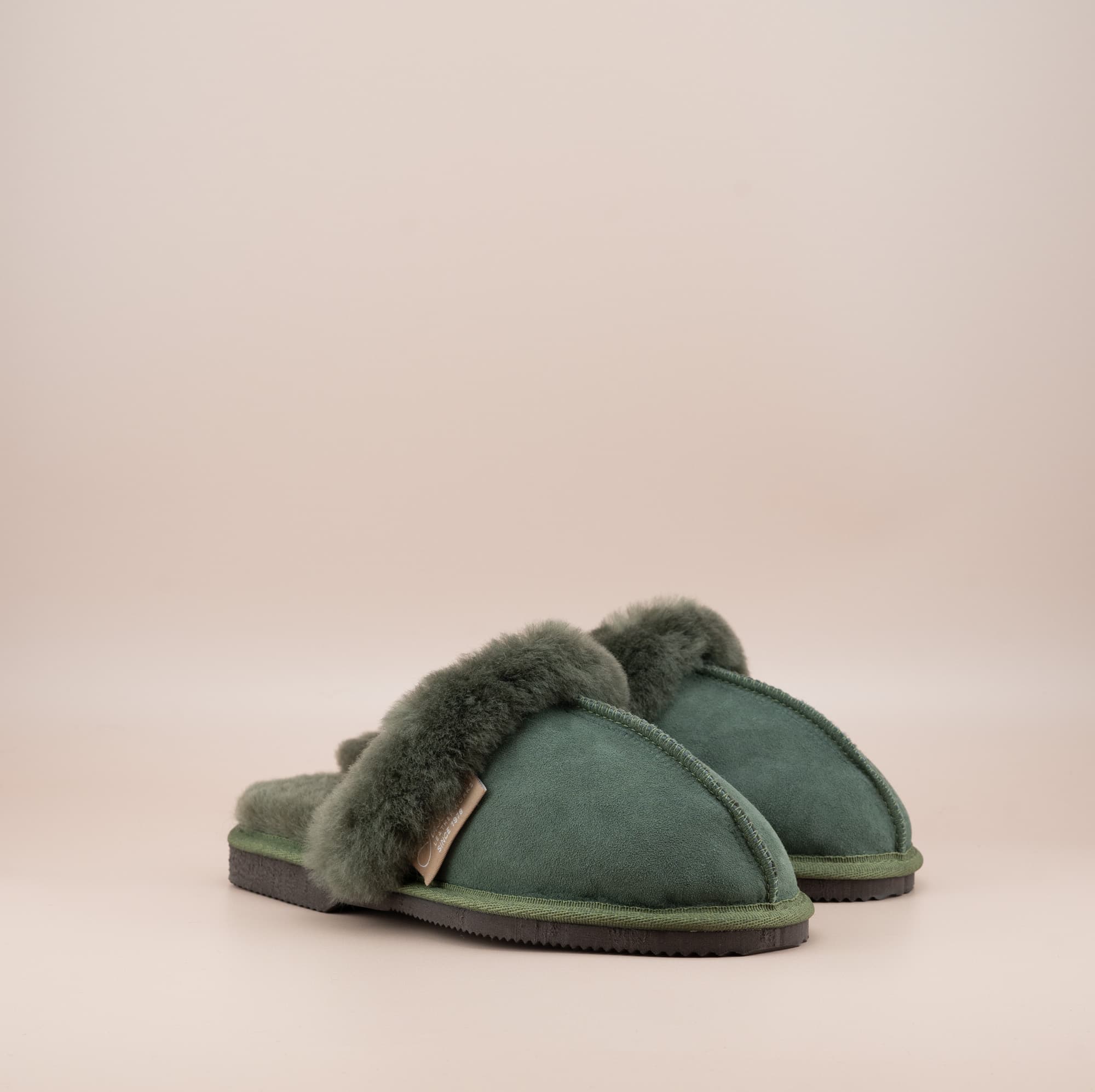 Men's ugg scuffs with a suede finish in olive and wool turn, side view of the pair. #color_olive