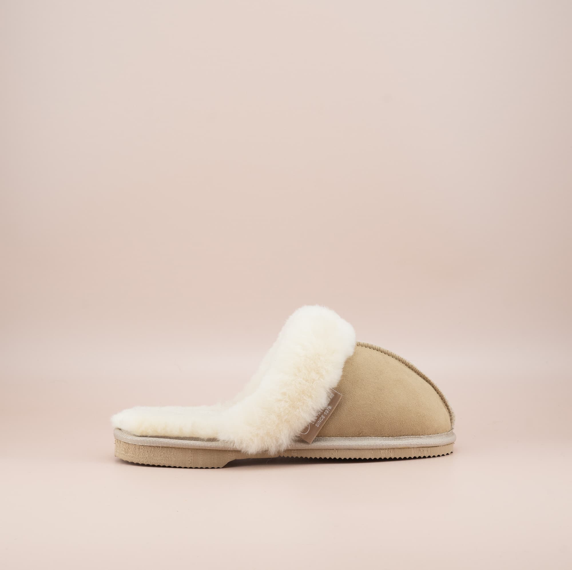 Men's ugg scuffs with a suede finish in sand and wool turn, single outer side view. #color_sand