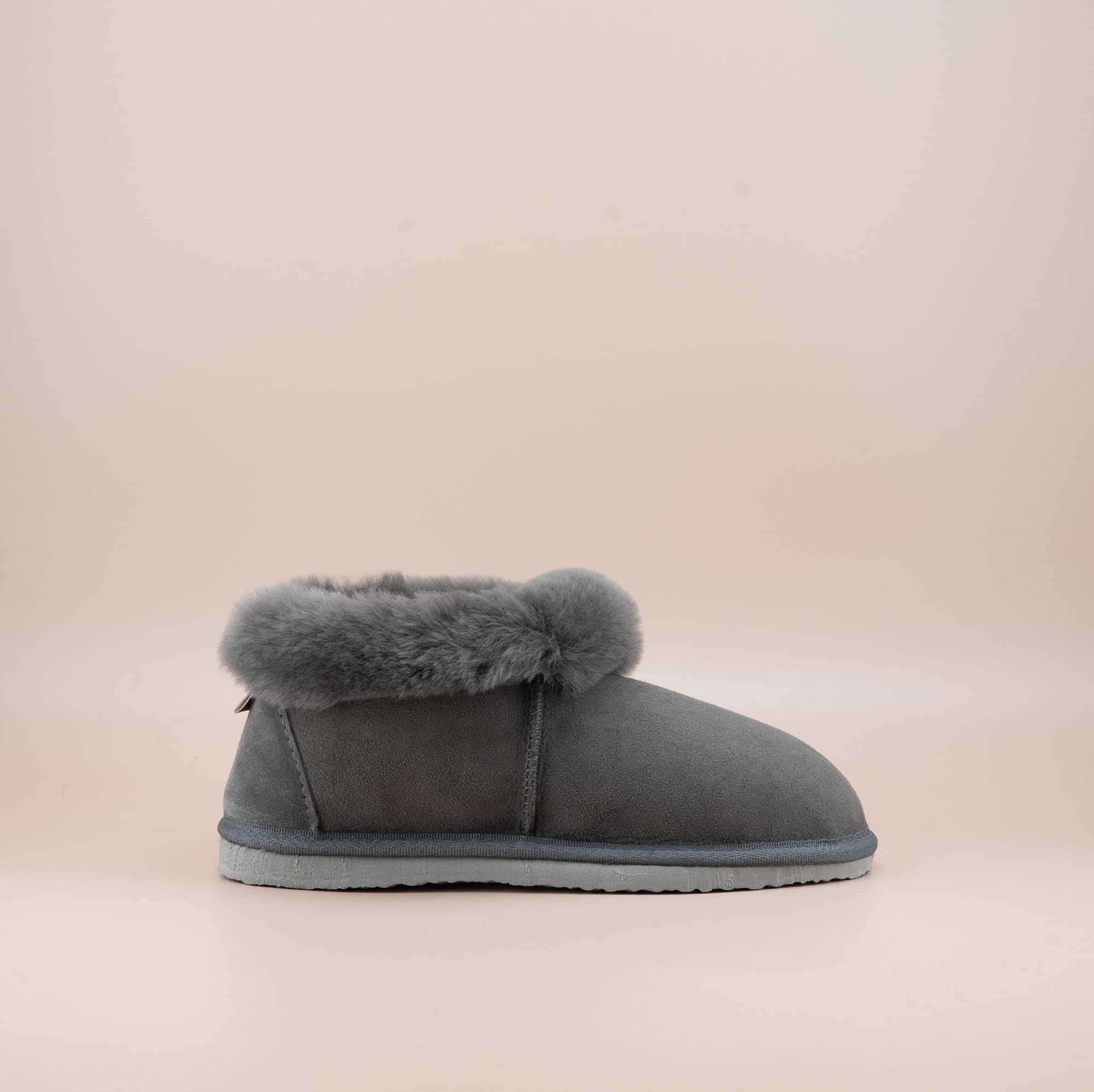 Men's ugg slippers with a suede finish in grey and wool turn, single side view. #color_grey