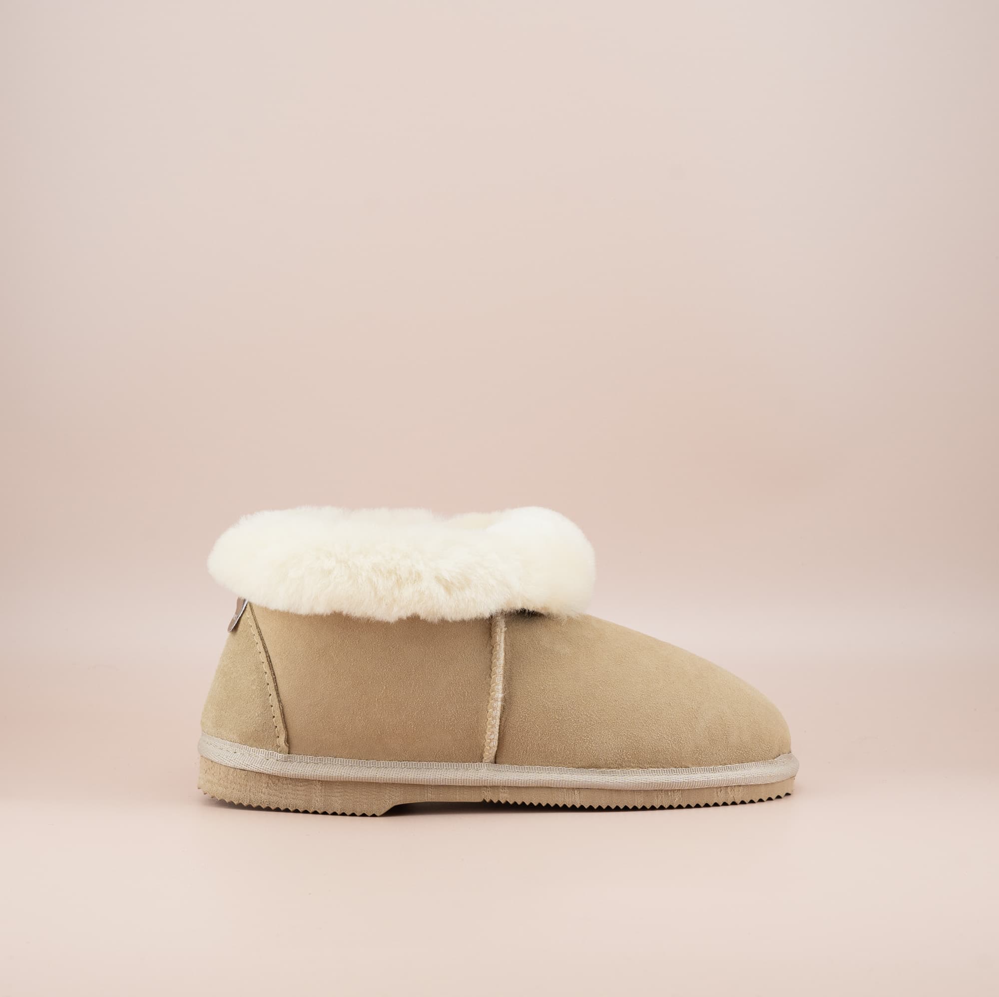 Men's ugg slippers with a suede finish in sand and wool turn, single side view. #color_sand