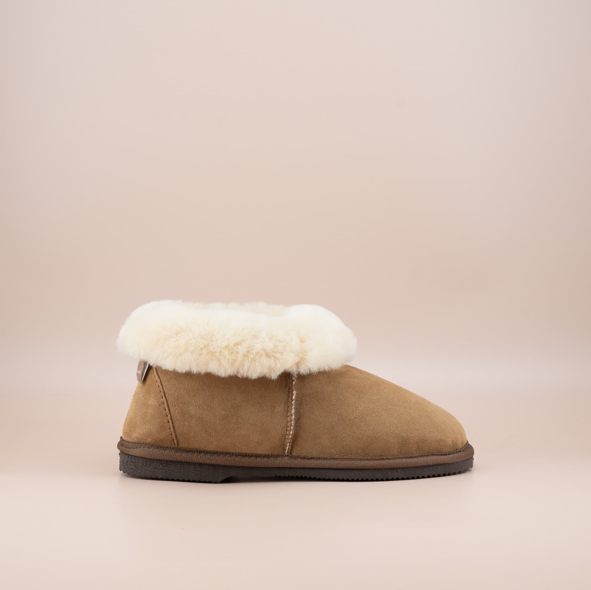 Men's ugg slippers with a suede finish in tan and wool turn, single side view. #color_tan