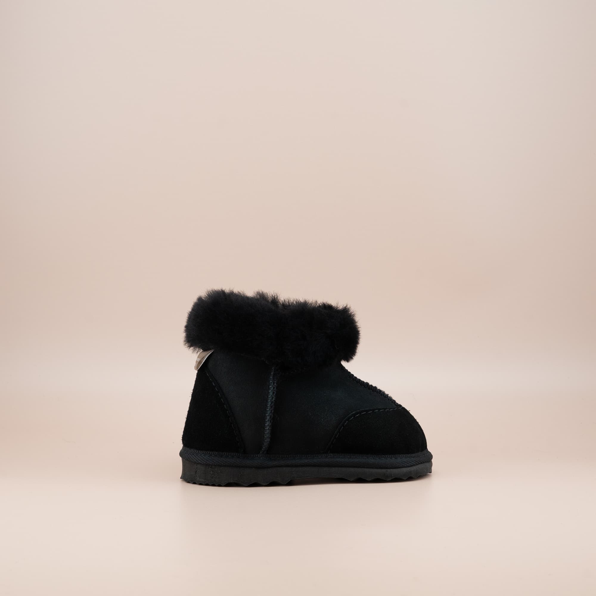 Toddler's ugg boots in soft suede black with wool turn, side view. #color_black