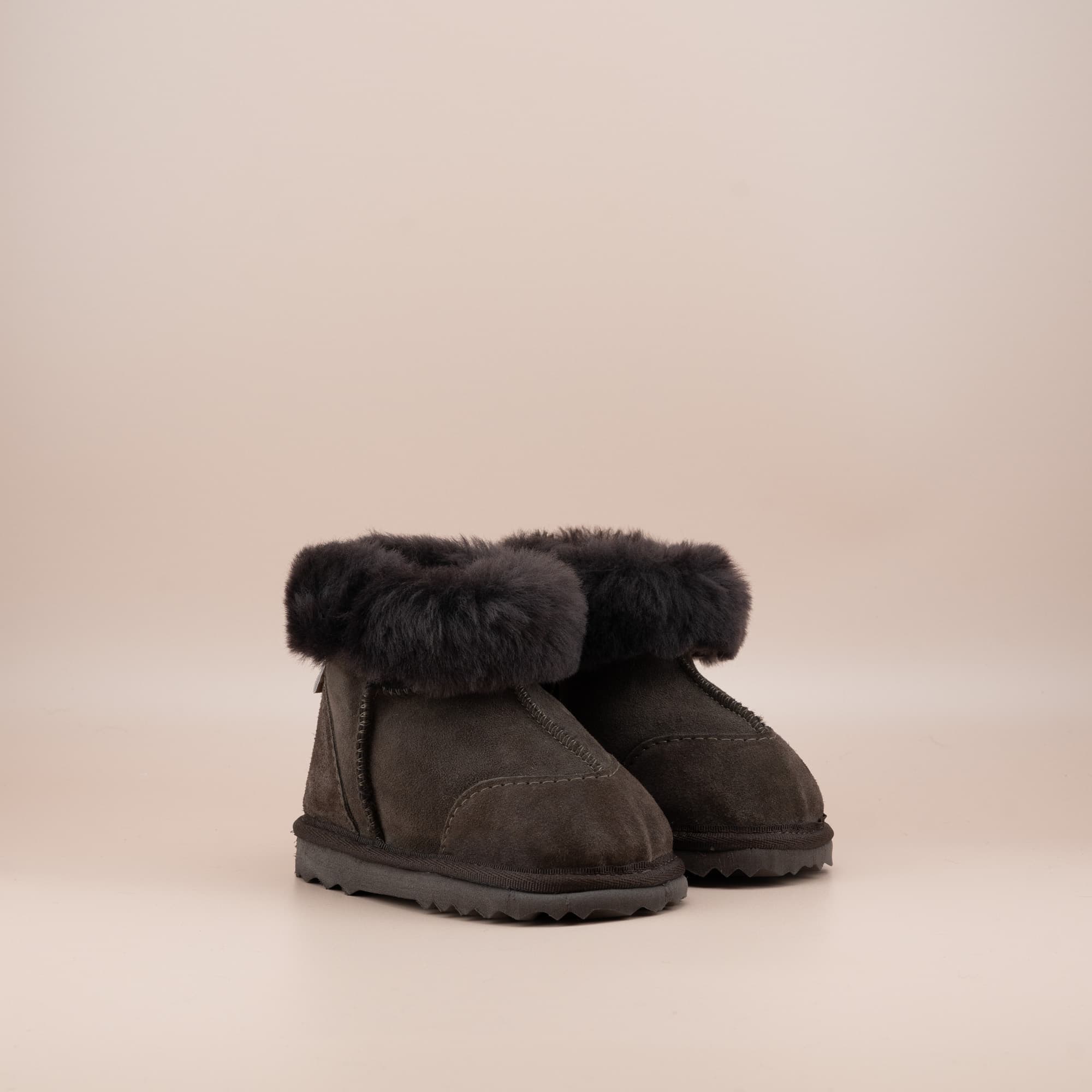 Toddler's ugg boots in soft suede chocolate with wool turn, front side view. #color_chocolate