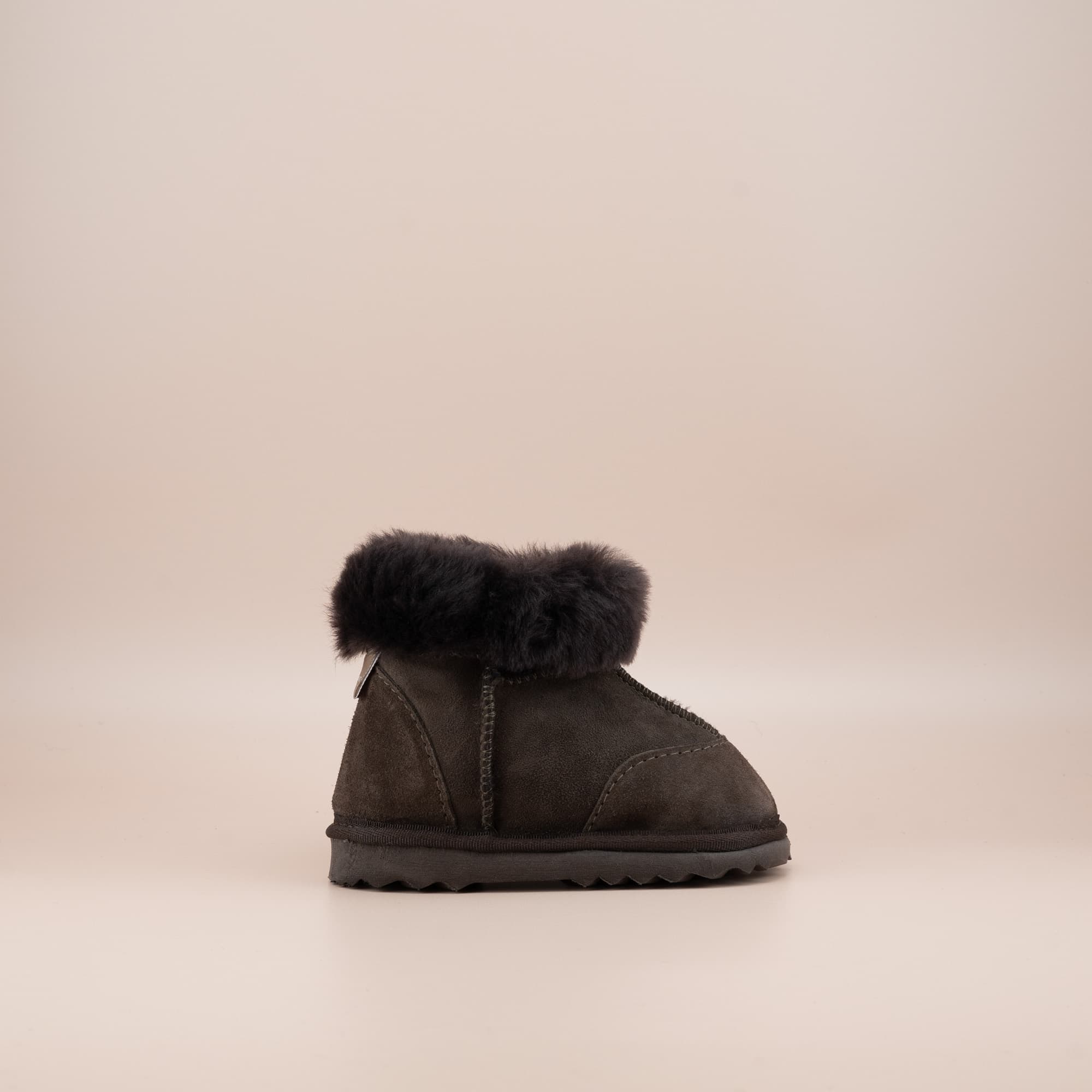 Toddler's ugg boots in soft suede chocolate with wool turn, side view. #color_chocolate