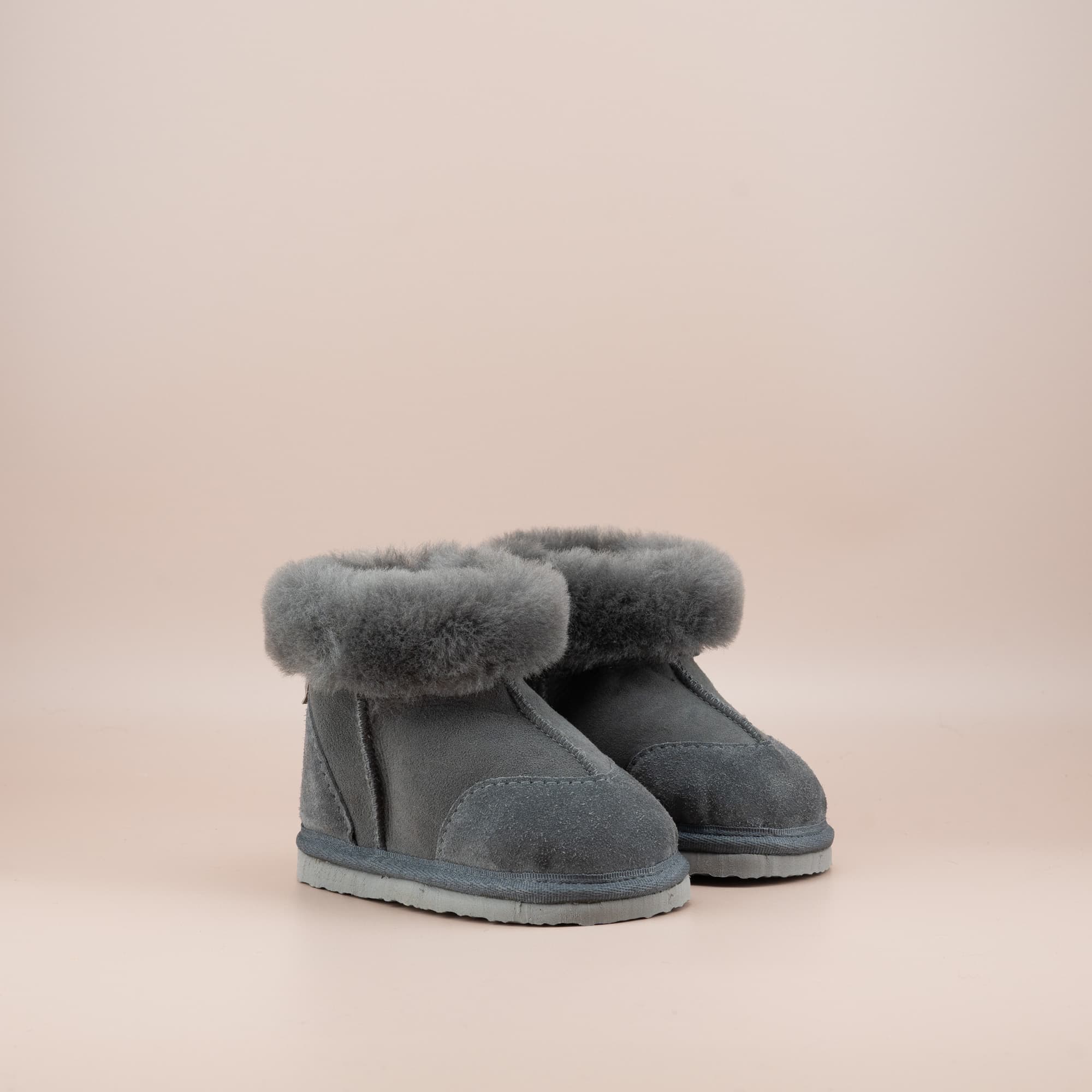 Toddler's ugg boots in soft suede grey with wool turn, front side view. #color_grey