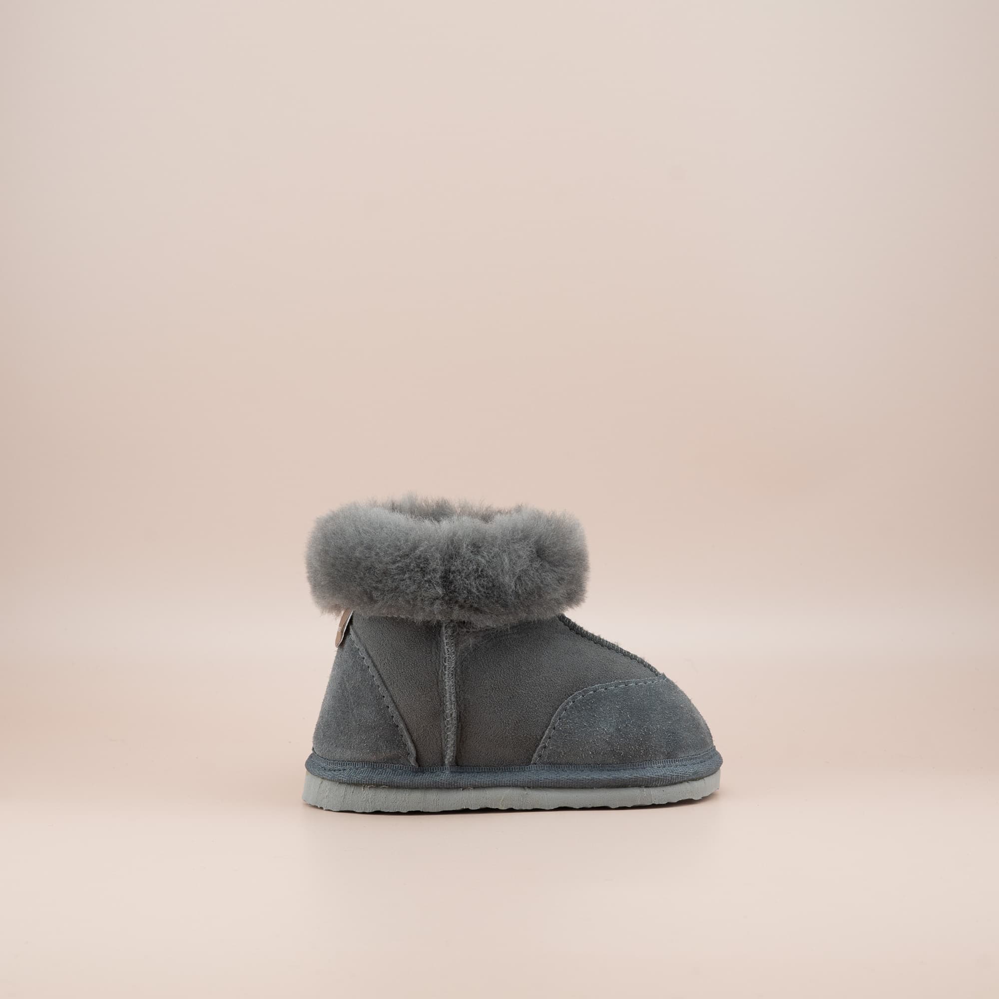 Toddler's ugg boots in soft suede grey with wool turn, side view. #color_grey